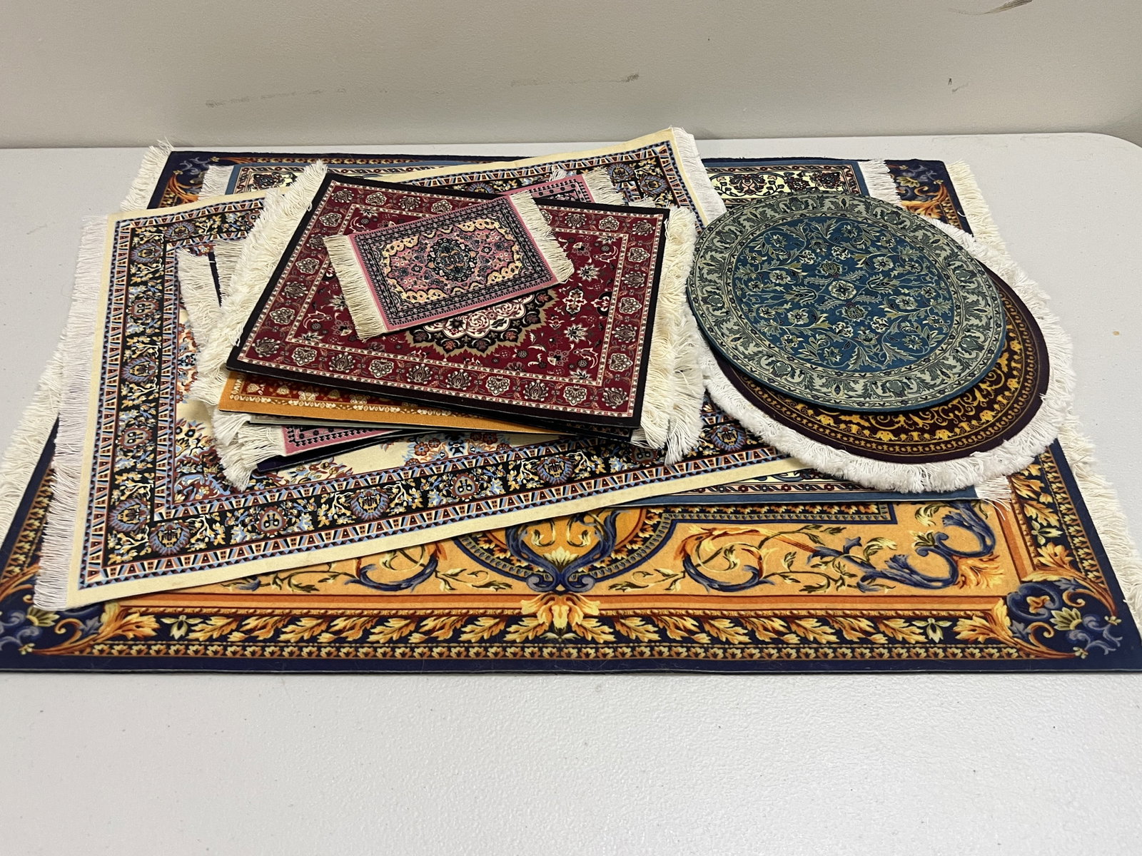 Grouping of Mouse Rugs: 13 mouse pads, some large measuring: 23" x 15.5" Condition: Lightly used. Low Estimate: 10.00 High Estimate: 10000.00