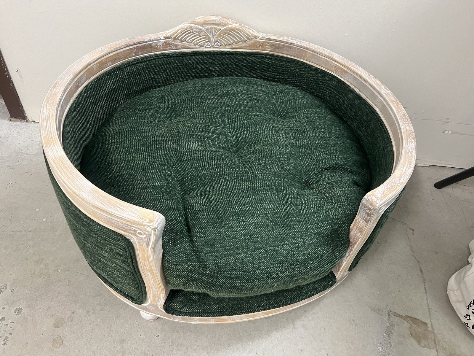 French Provincial Style Dog Bed: Cute wood and green fabric dog bed. White washed wood. Dimensions: H 19" x W 29" x D 25" Condition: Some wear to one side of the cushion. Low Estimate: 10.00 High Estimate: 10000.00