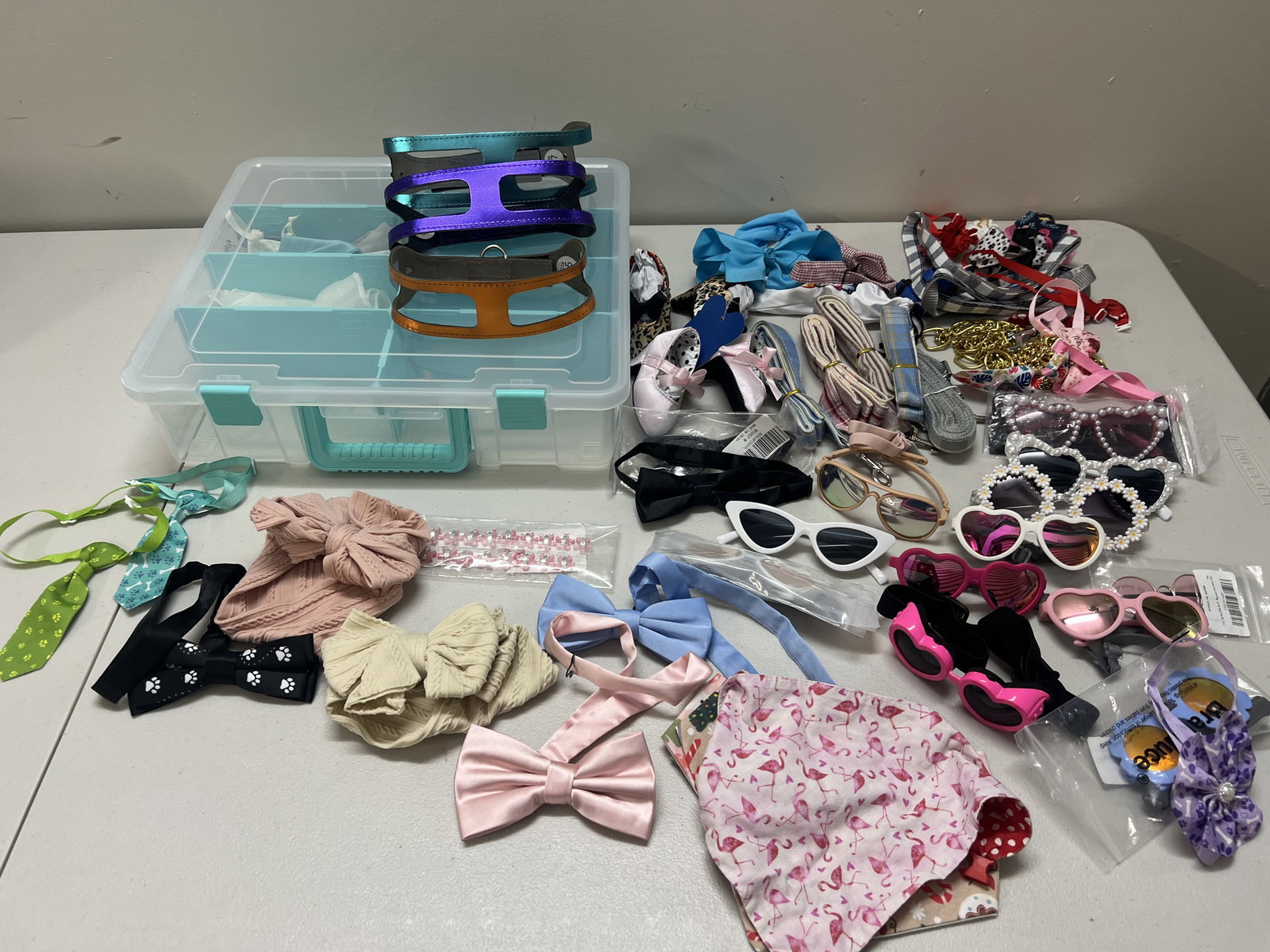 Dog Accessories and Dress up Costumes: Ties, collars, leashes, bows, sunglasses and more. Dimensions: For a small dog, under 15 pounds. Low Estimate: 10.00 High Estimate: 10000.00