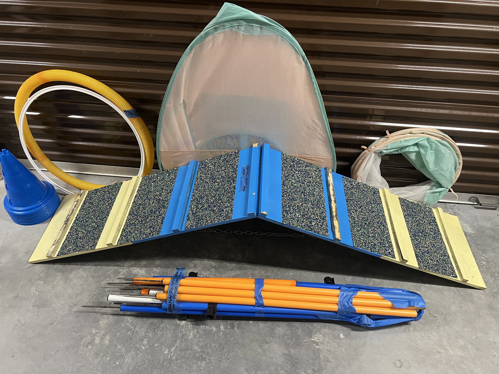 Dog Agility Grouping: Dog training or agility including tunnel, cones, poles, stepd and more. Dimensions: Stairs L78" x 15.5". Condition: Used, signs of use. Low Estimate: 10.00 High Estimate: 10000.00