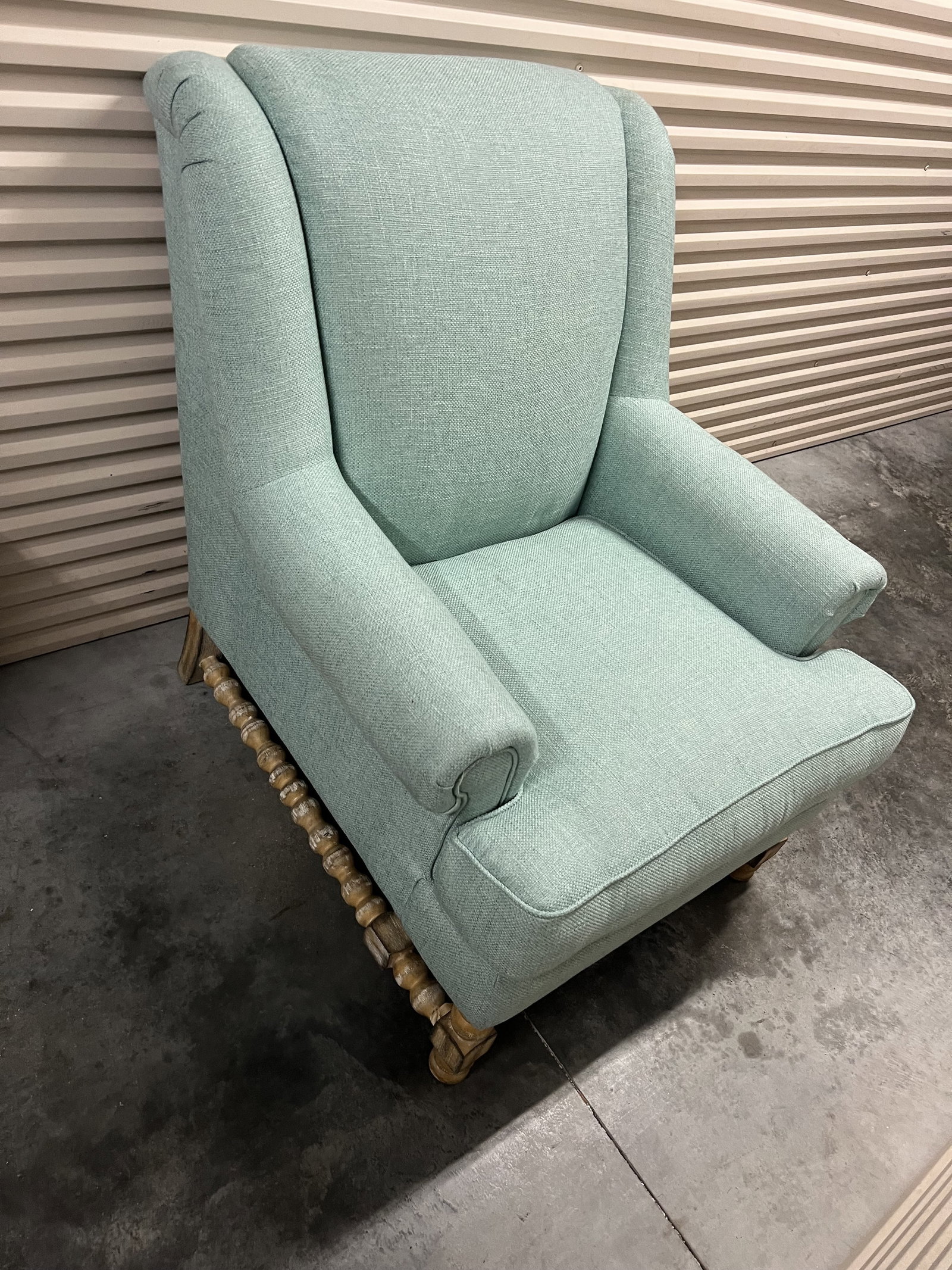 Large Coastal Blue Arm Chair: Coastal teal wirh white washed wood. Dimensions: H 39" x W 32" x D 35" Condition: Clean, only minor spot to seat. Low Estimate: 10.00 High Estimate: 10000.00