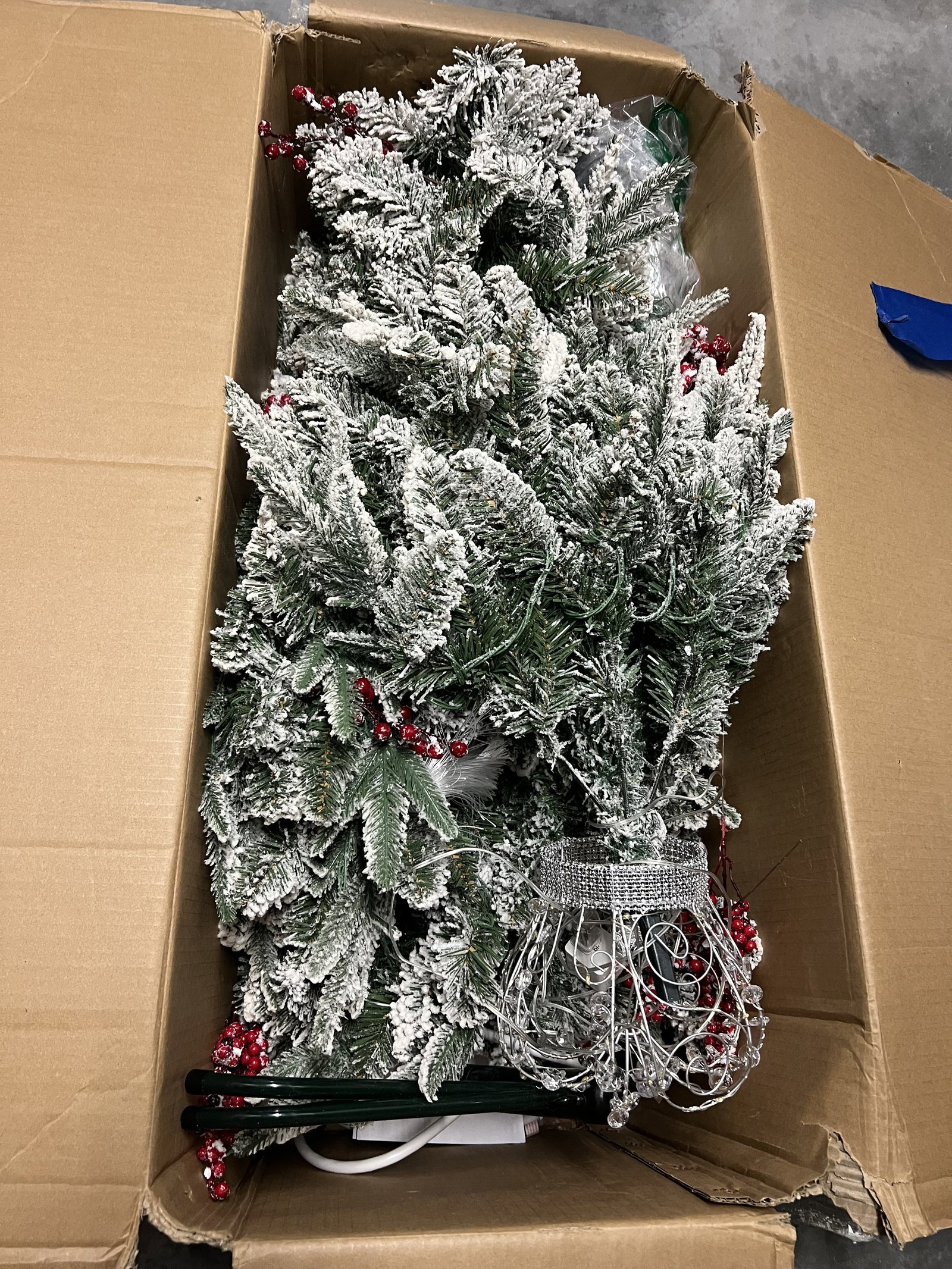 Flocked Christmas Tree: Unsure of exact size but about 6'. Condition: Used, usable. Low Estimate: 10.00 High Estimate: 10000.00