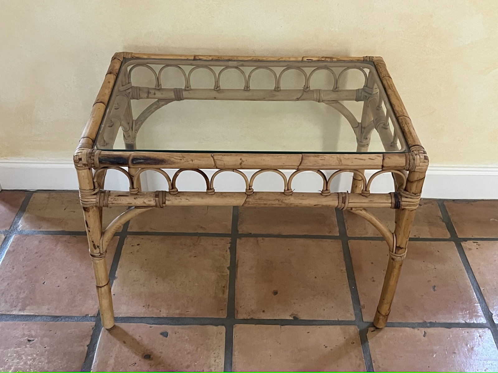 Bamboo Side Table: Glass top, side table, light colored bamboo. Dimensions: L 26.5" x W 18.5" x H 19" Condition: Vintage, normal signs of age. Low Estimate: 10.00 High Estimate: 10000.00