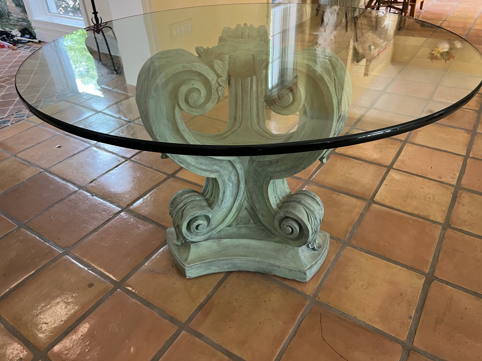 Neoclassical Style Table: Pedestal table, acanthus leaf design, verde gris color, Neoclassical style attributed to Ballard design. Dimensions: Base" H 29" x W 24" Top: Dia: 48" x 1" round bevel glass top. Condition: Minor