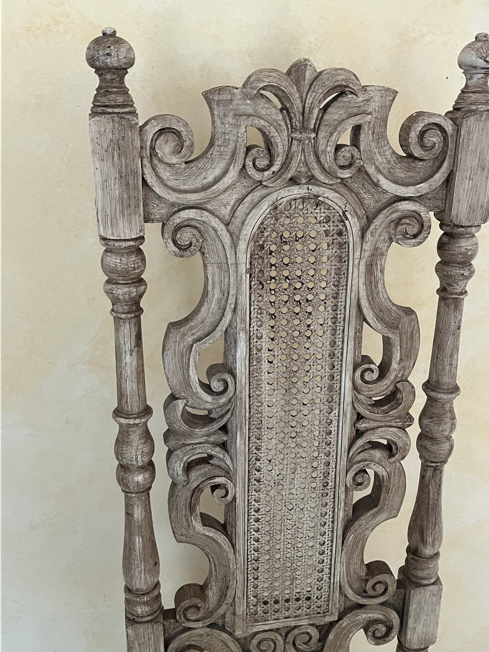 Vintage Italian Style Carved Chair: Carved wood white washed caned side chair. H 49" x W 20" x Deep 17" . Seat 18.5" Damage to seat. Low Estimate: 10.00 High Estimate: 10000.00