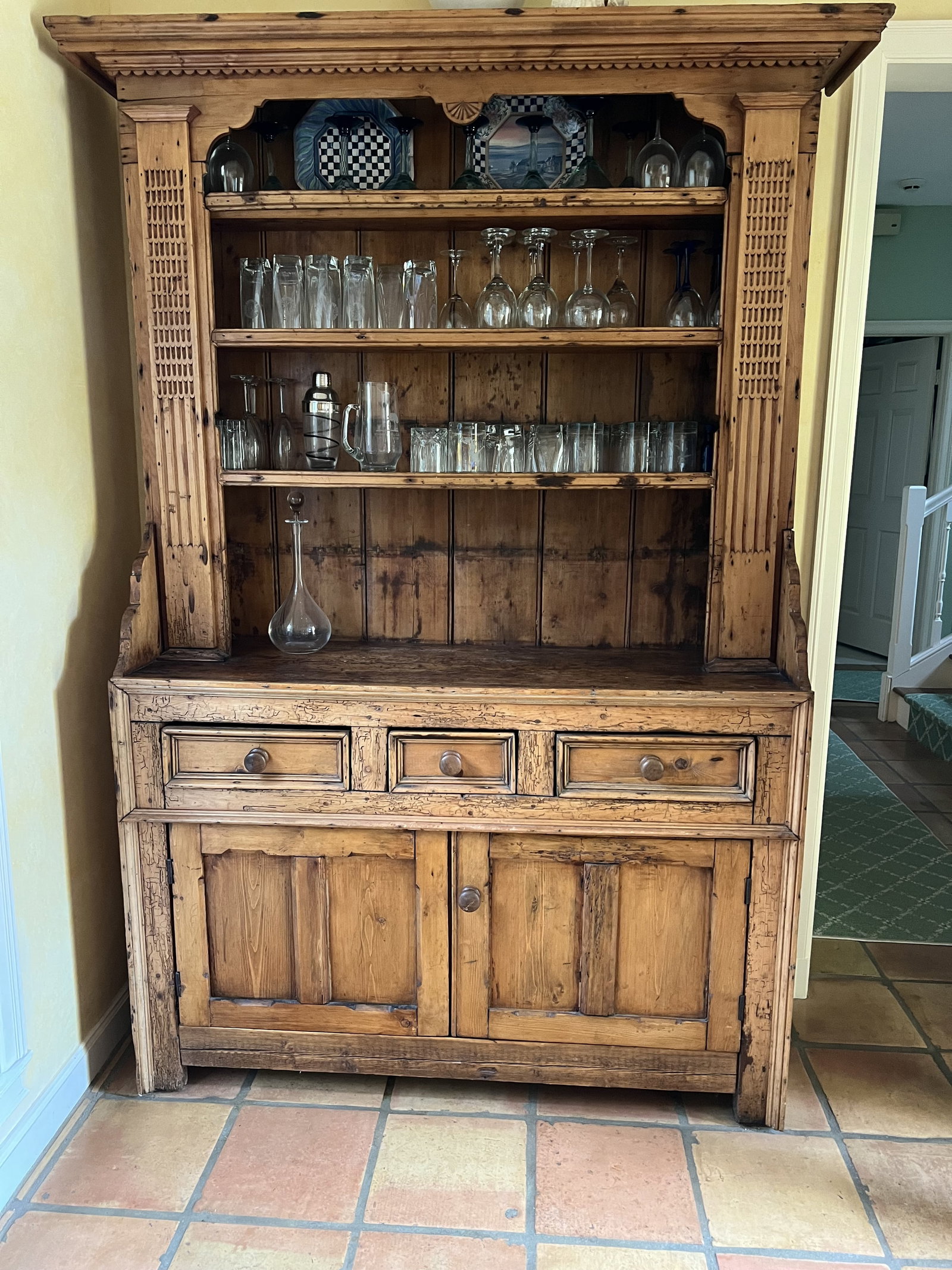 Antique Lighted Wormwood Pine Stepback Hutch: Antique carved wood decoration country pine hutch, fixed 3 shelf, 3 drawers over 2 door bottom, H 84" x W 53" x 18" deep. Minor scratches to bottom Low Estimate: 10.00 High Estimate: 10000.00