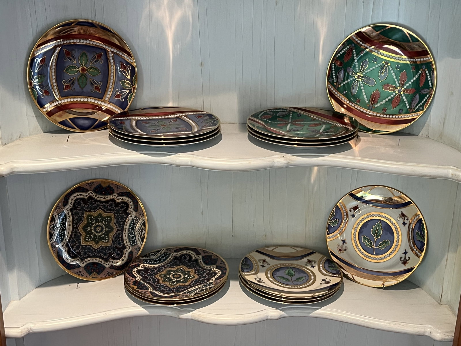 (16) Gold Buffet Royal Gallery Plates: Porcelain plates, Made in Sri Lanka, Christmas pattern with gold accents. Dimensions: 8.5" diameter Condition: Lightly used, no chips. Low Estimate: 10.00 High Estimate: 10000.00