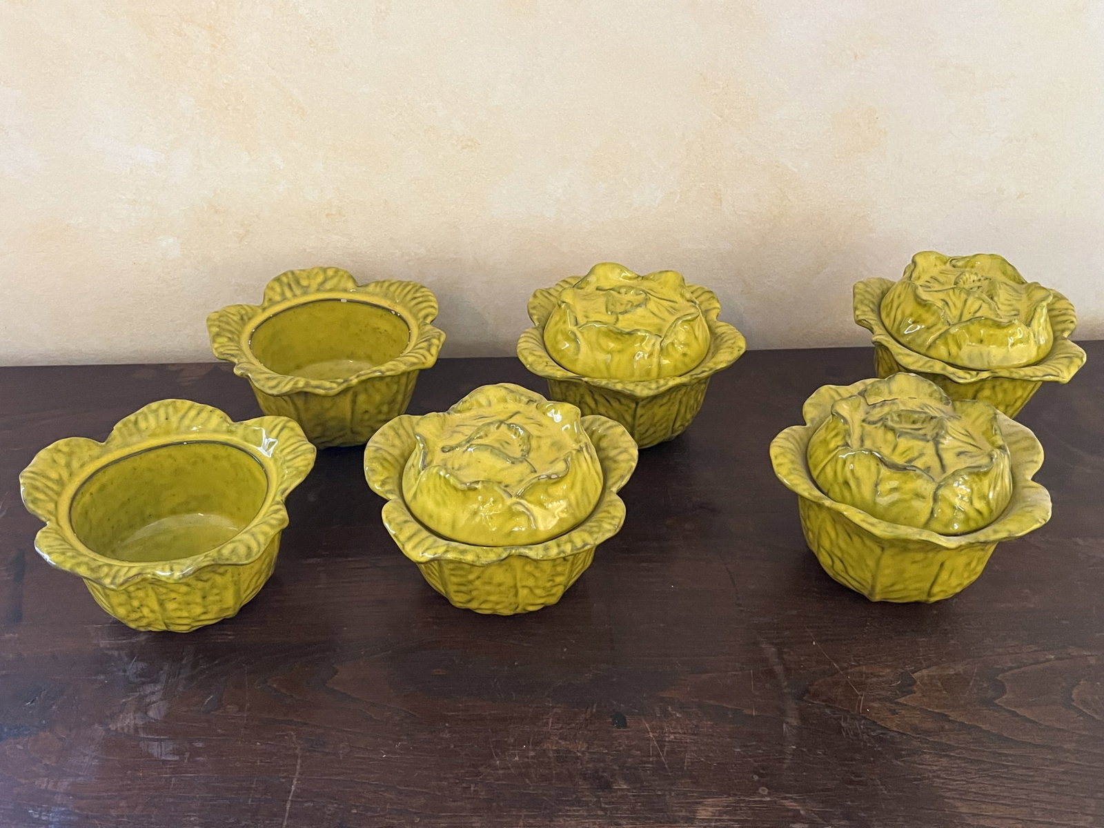 Vintage Italian Lidded Cabbage Bowls: Chartreuse color, two without lids. Dimensions: Dia: 6" H 4.5" Condition: One with repair, two without lids. Low Estimate: 10.00 High Estimate: 10000.00