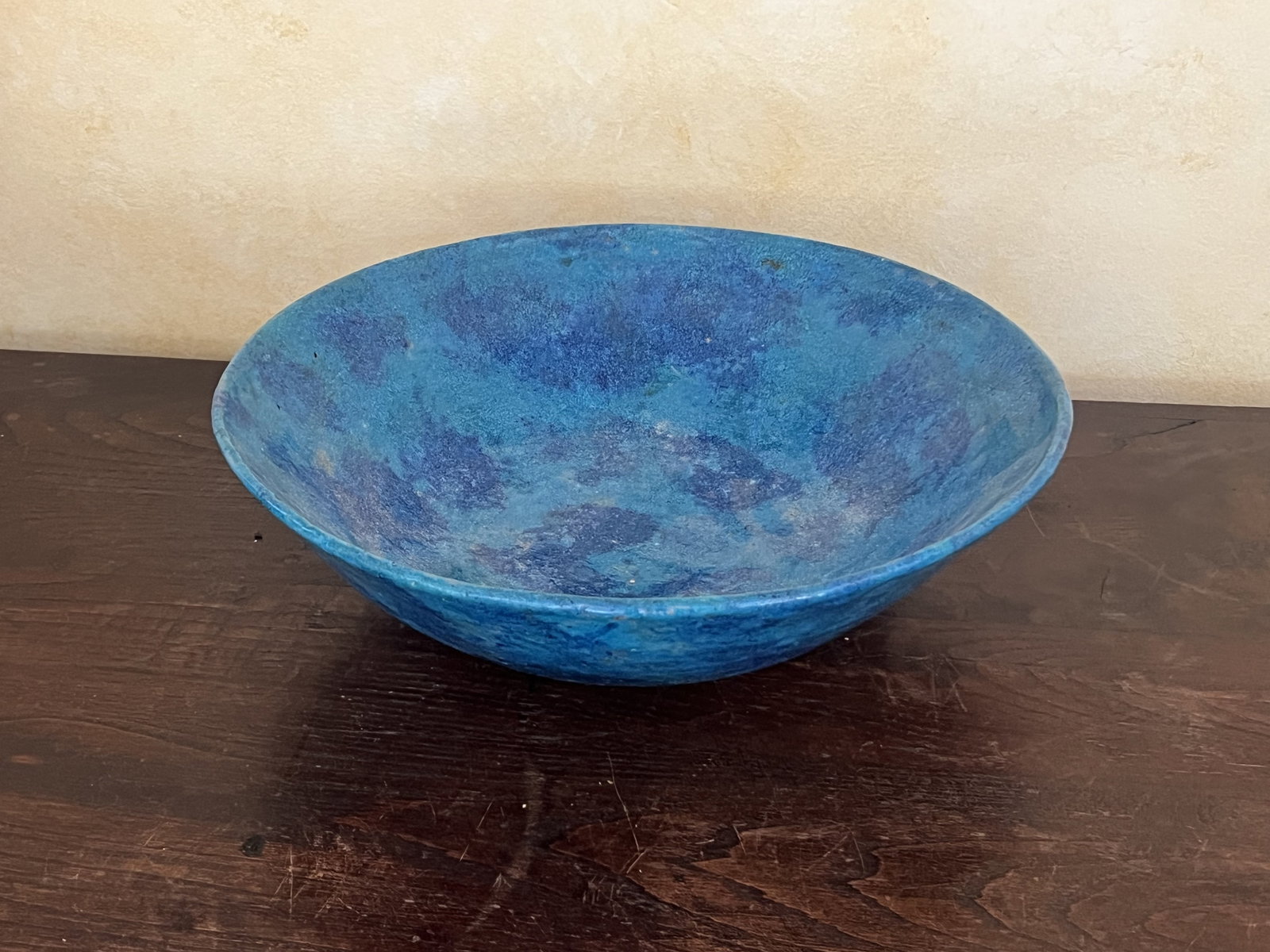 Turquoise Blue Pottery Bowl Austria: A handmade glazed terra cotta bowl, marked Austria and numbered. Dimensions: H 3.5" x Dia: 12.5" Condition: No issues to note. Low Estimate: 10.00 High Estimate: 10000.00