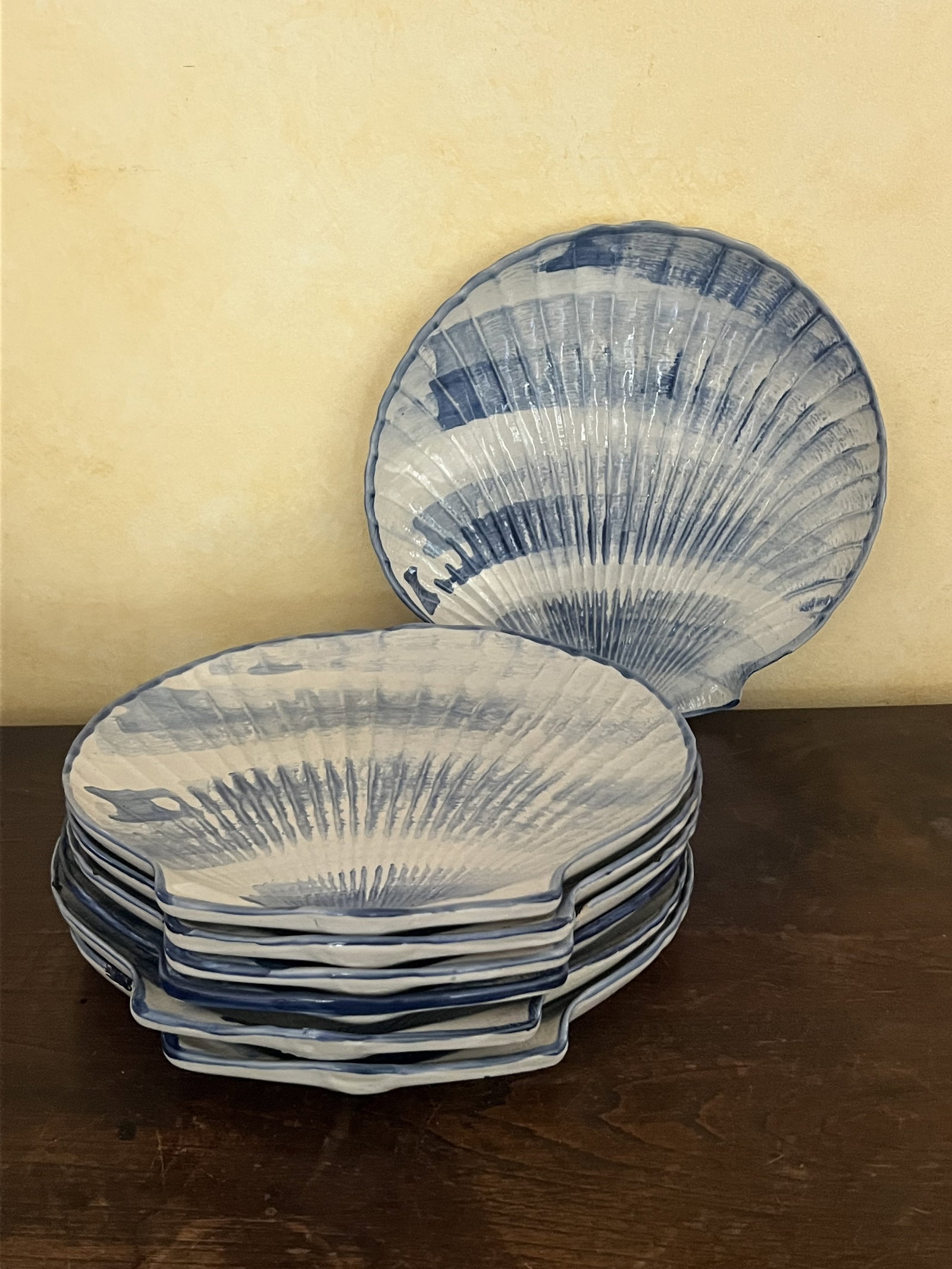 Louisville Stoneware Kentucky Made Shell Plates: (7) Louisville Stoneware plates in a shell pattern, dinner size, nice blue colors. DImensions: 12" Condition: Scattered chips to edges of half of them. Low Estimate: 10.00 High Estimate: 10000.00