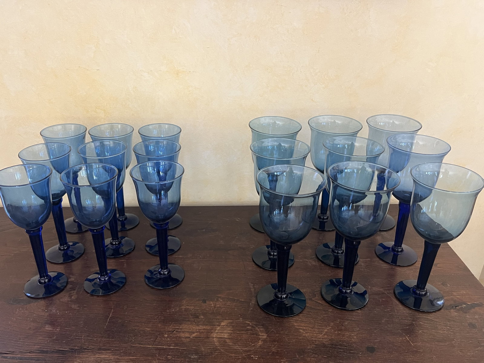 Cobalt Blue Wine Glasses: (9) White wine and (9) red wine. Delicate glasses, all in good condition: Dimensions: largest: H 9.5" Condition: Good. Low Estimate: 10.00 High Estimate: 10000.00