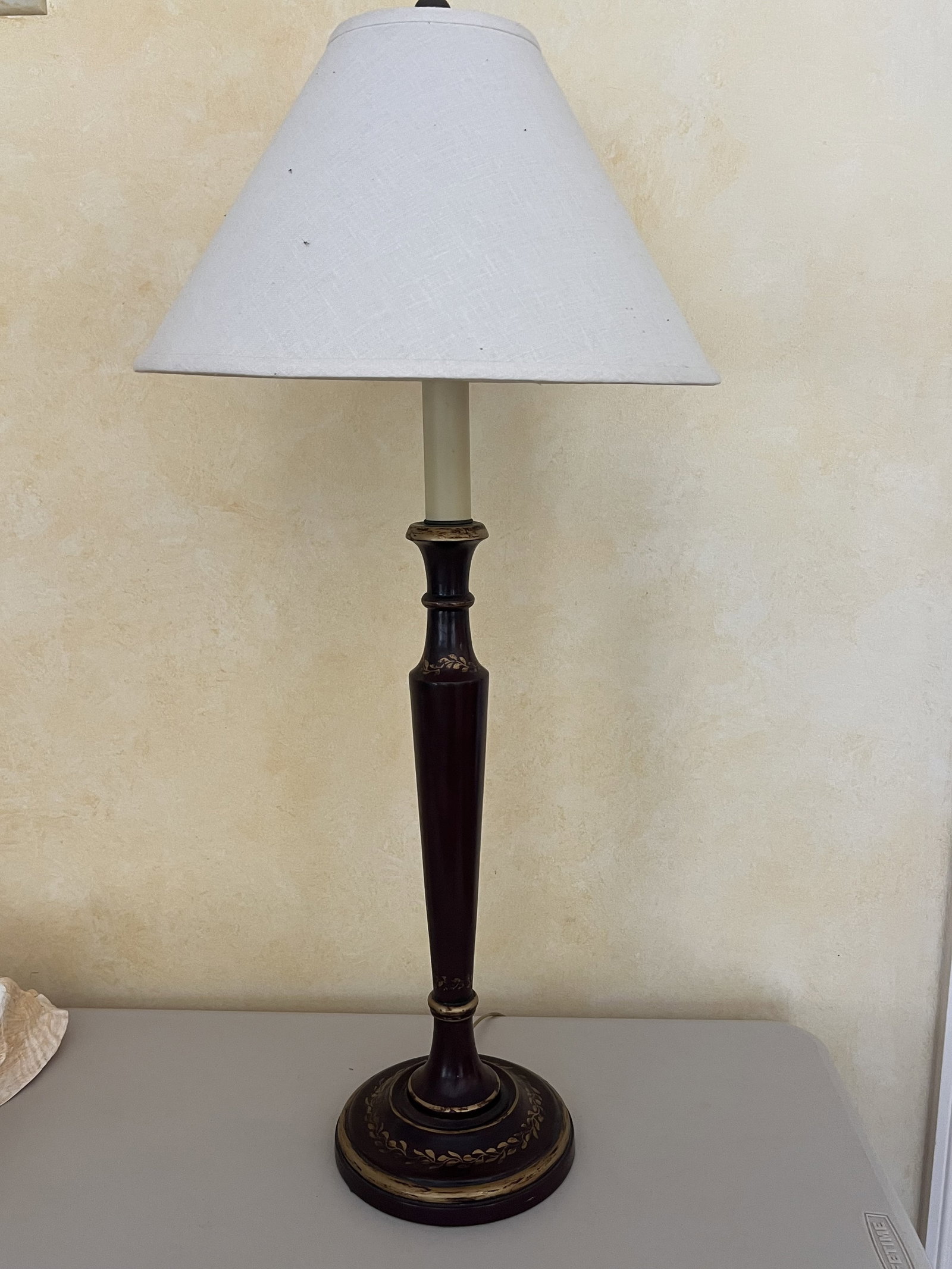 Red Tole Table Lamp: Red and gold, vintage. Dimensions: H 32" (to finial) x Dia: 7" Condition: Light signs of age. Low Estimate: 10.00 High Estimate: 10000.00