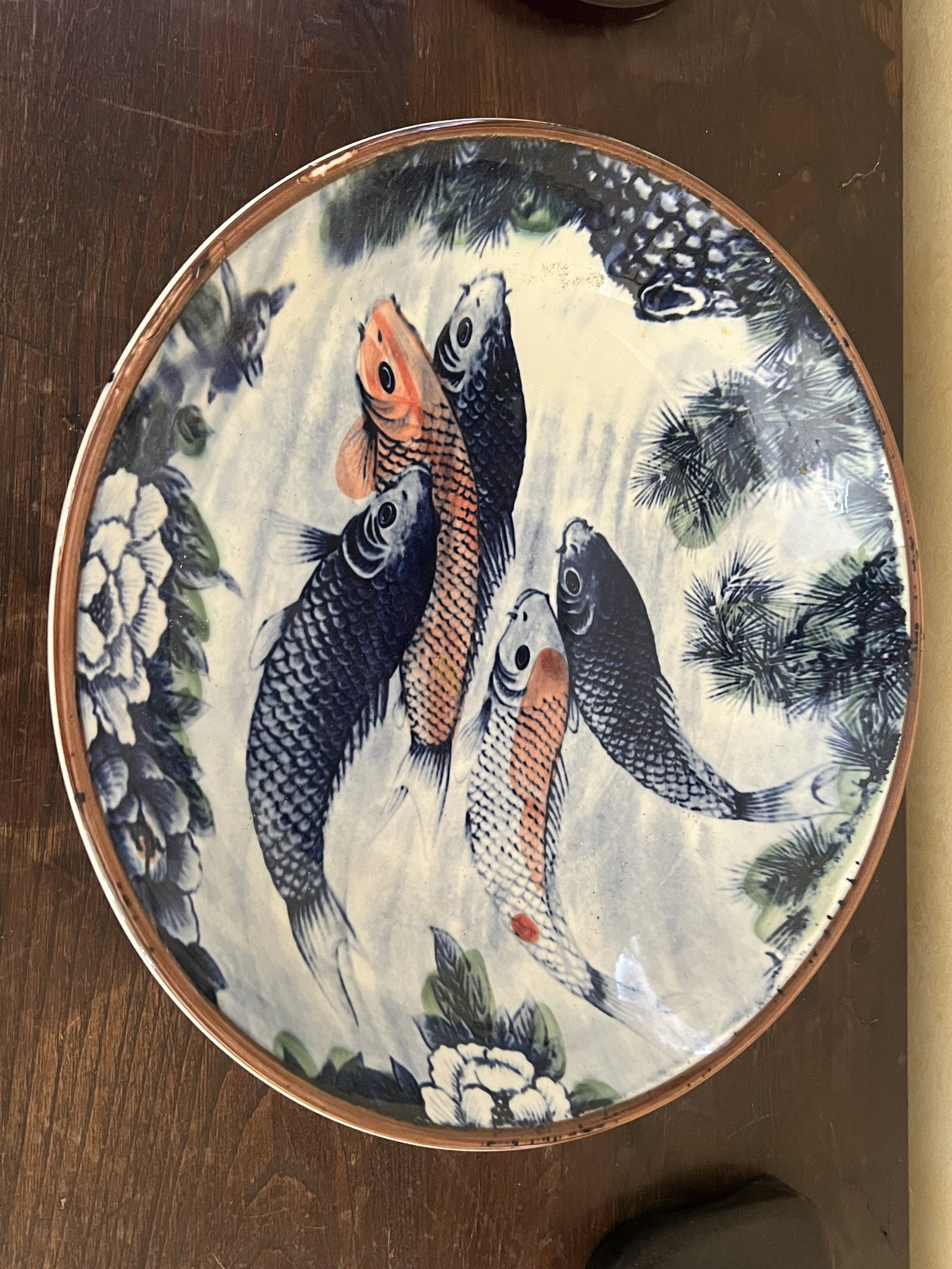 Japanese Koi Centerpiece Bowl: A vintage porcelain bowl by Sun Ceramics. Dimensions: H 2.5" x Dia: 14" Condition: Used, showing only light signs. Low Estimate: 10.00 High Estimate: 10000.00