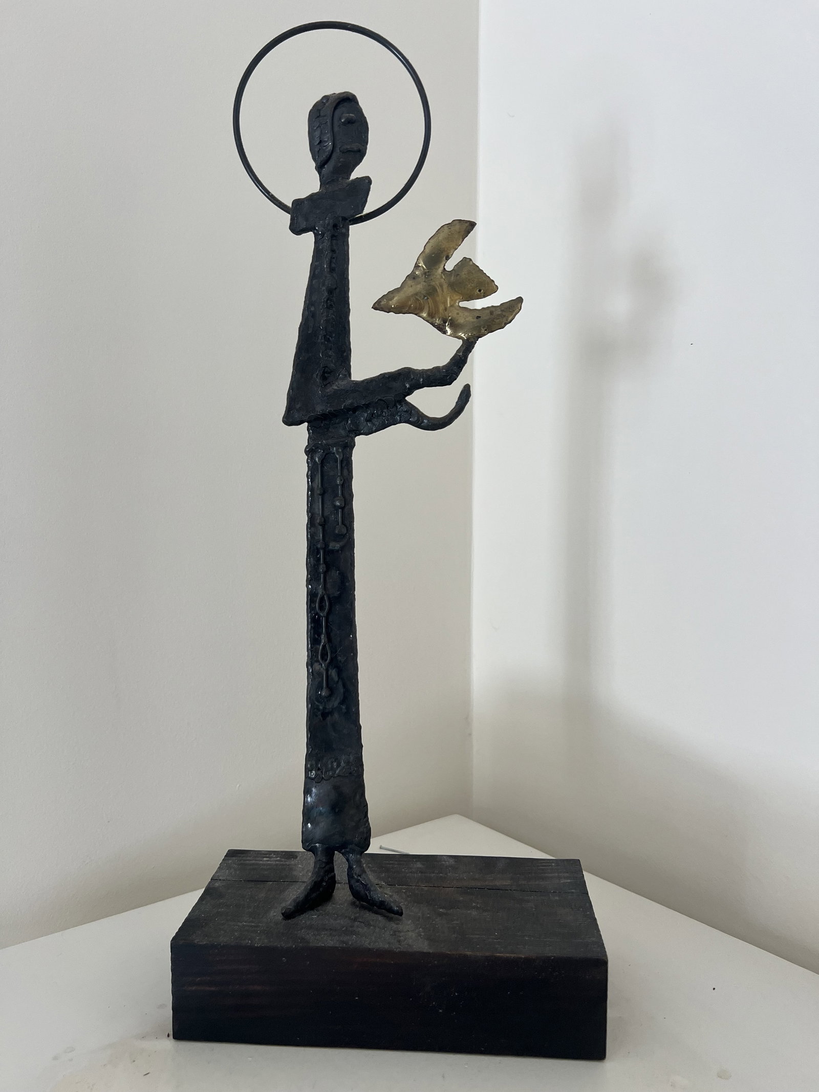 Mid Century Sculpture of Saint Francis: Likely by Emaus Cuernavaca, bronze on wood base. Sticker on back says SFS. Dimensions: H 19" x W 8" x D 4" Condition:Minor signs of age. Low Estimate: 10.00 High Estimate: 10000.00