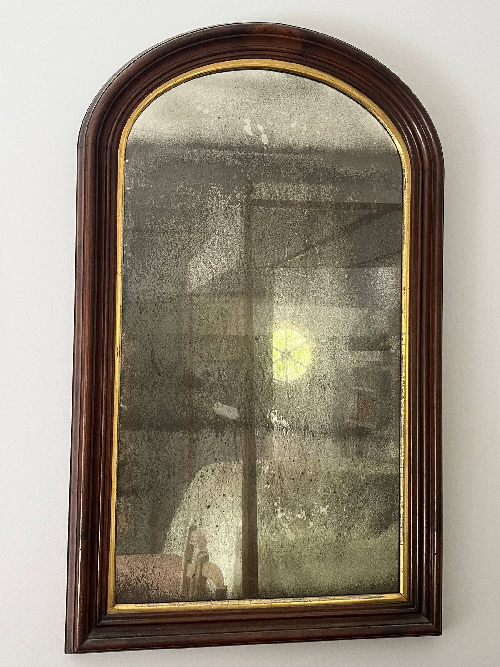 Antique Early American Mirror: Antique original mirror, arched top, gold leaf accent. Dimensions: H 40" x W 24" x D 3" Condition: as shown, lovely. Low Estimate: 10.00 High Estimate: 10000.00