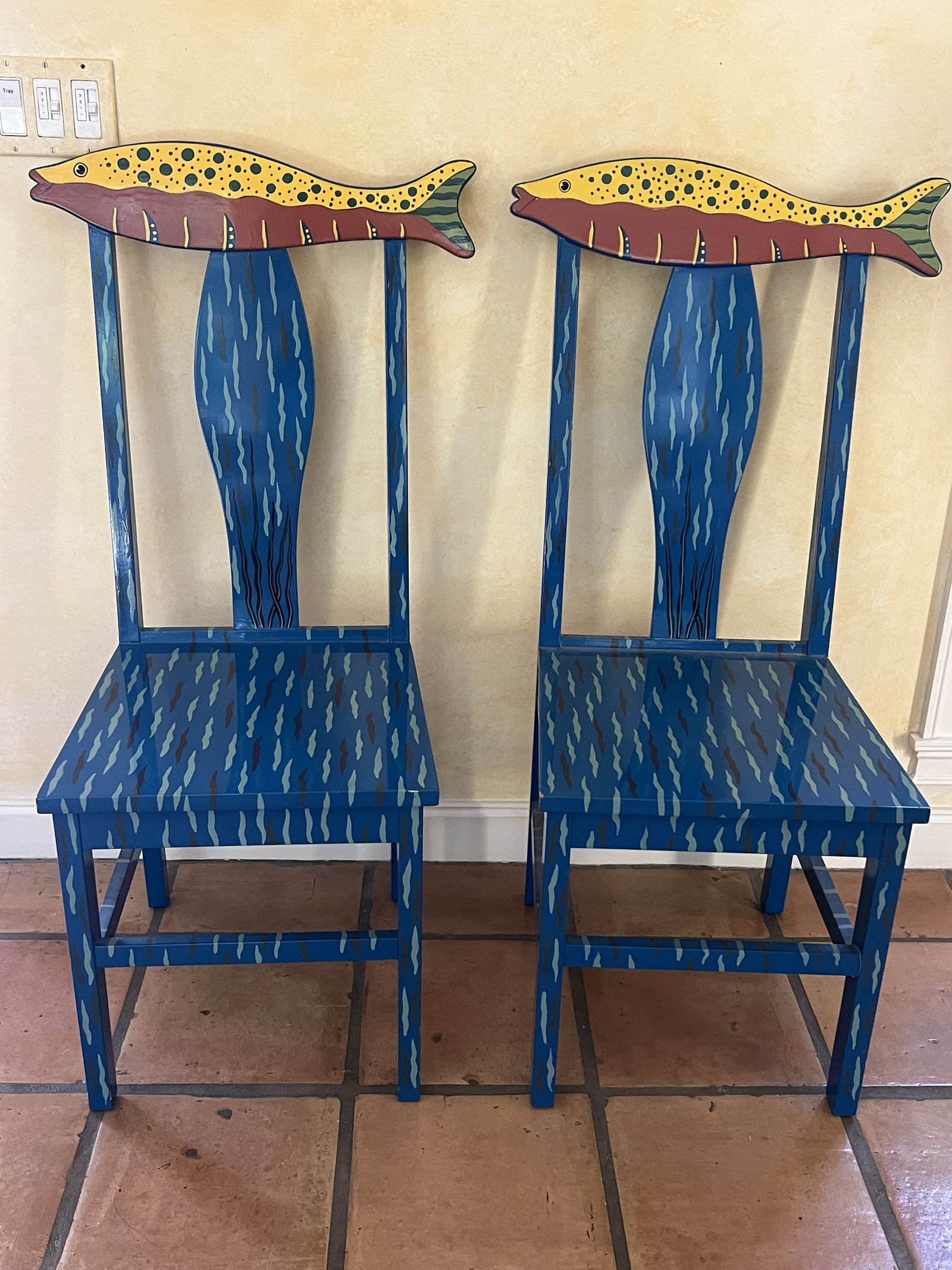 Pair of Painted Fish Chairs: Solid painted wood. Dimensions: H 42" x W 21.5" x D 16.5" x Seat H: 18.5" Low Estimate: 10.00 High Estimate: 10000.00