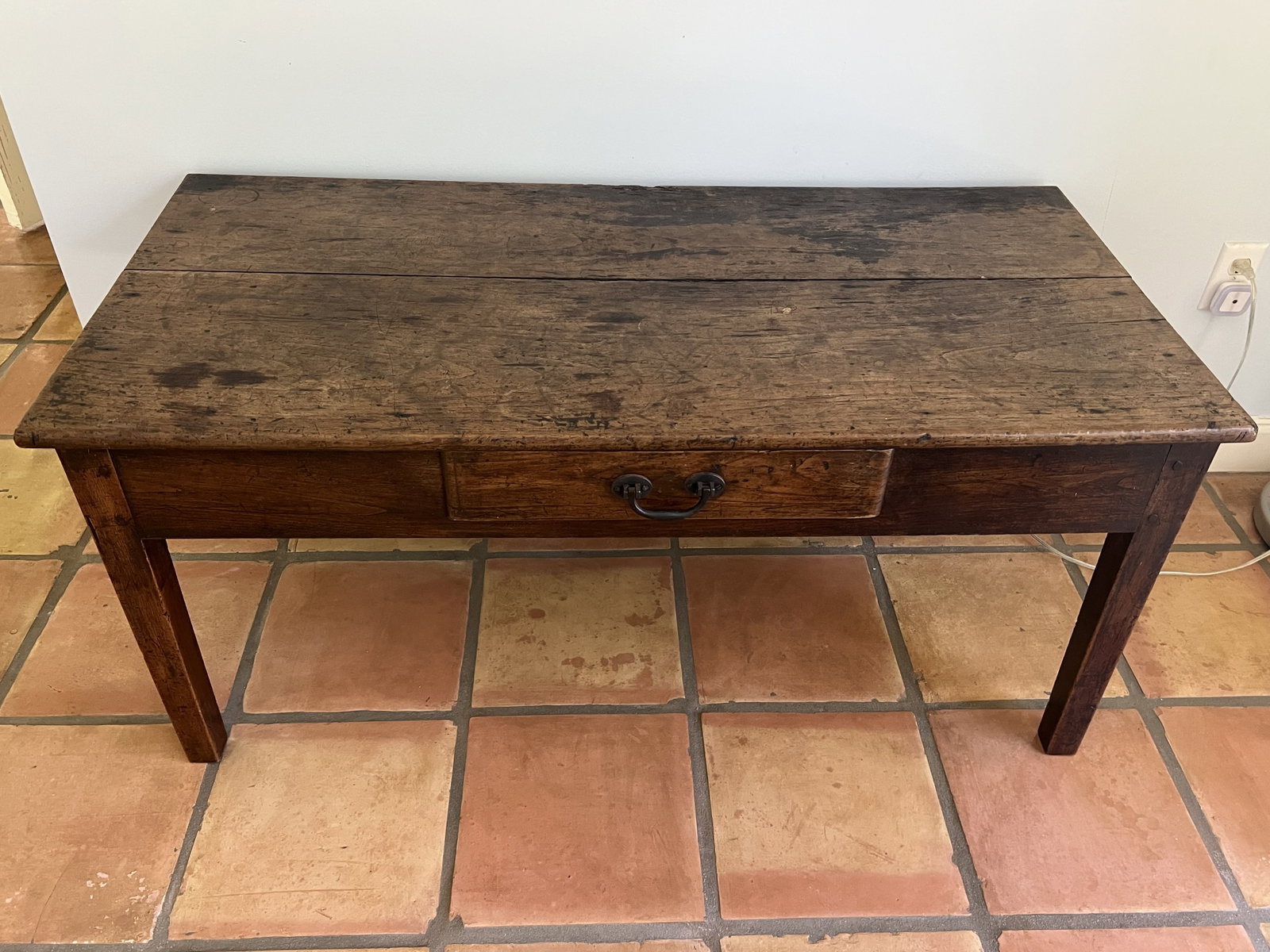 Antique Coffee Table: Antique 20th Century traditional coffee table with all all the right patina. Iron drawer pull. Dimensions: H 21" x L 47" x W 23" Condition: Normal signs of age and use. Handsome. Low Estimate: 10.00