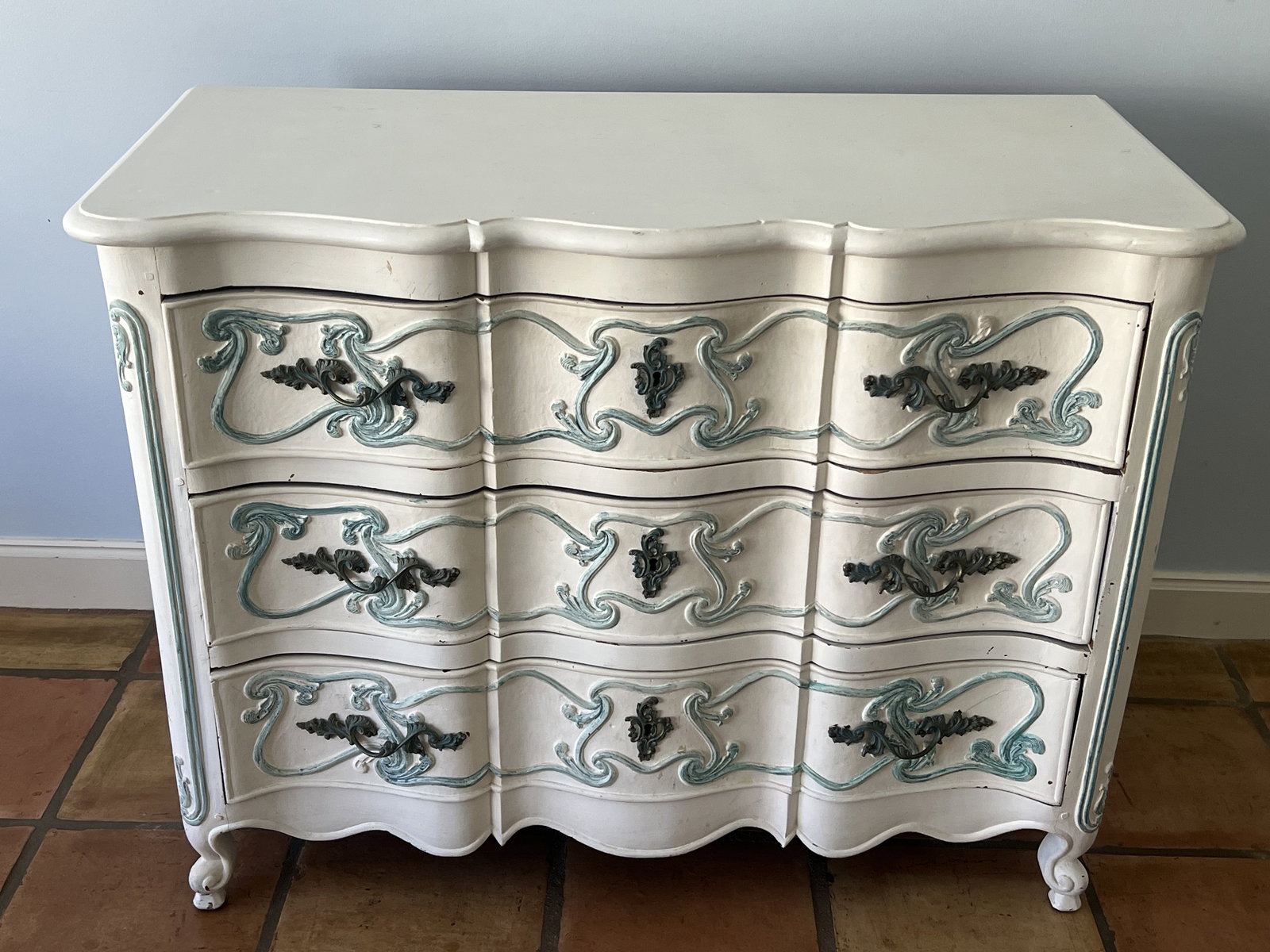 Antique Painted French Provincial Dresser: Chest of drawers, 3 drawer, painted white and blue. Dimensions: H 32" x W 42" x D 19" Condition: Signs of use. Low Estimate: 10.00 High Estimate: 10000.00