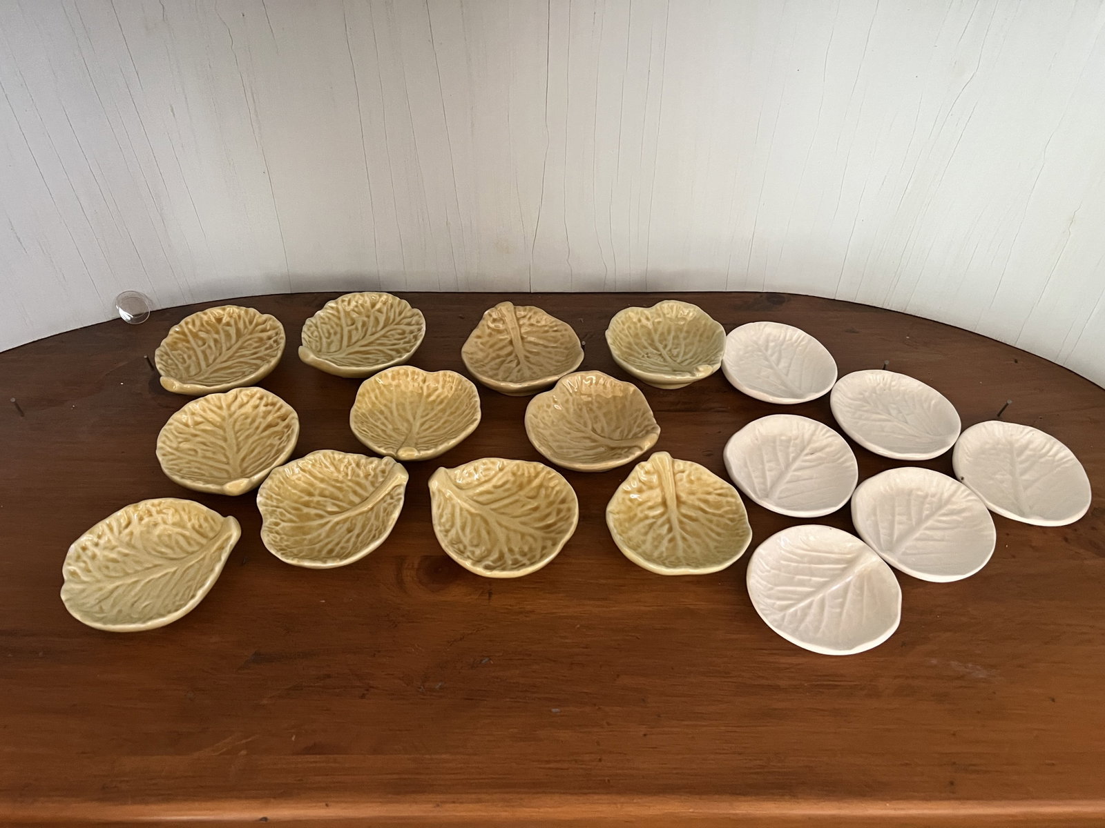 Cabbage Leaf Butter Pats: 11 yellow and 6 white. The yellow has an indistinct marking under as well as paper label. White ones are unmarked. Dimensions: Yellow: 3.5" Condition: All presenting well with no issues to note. Low