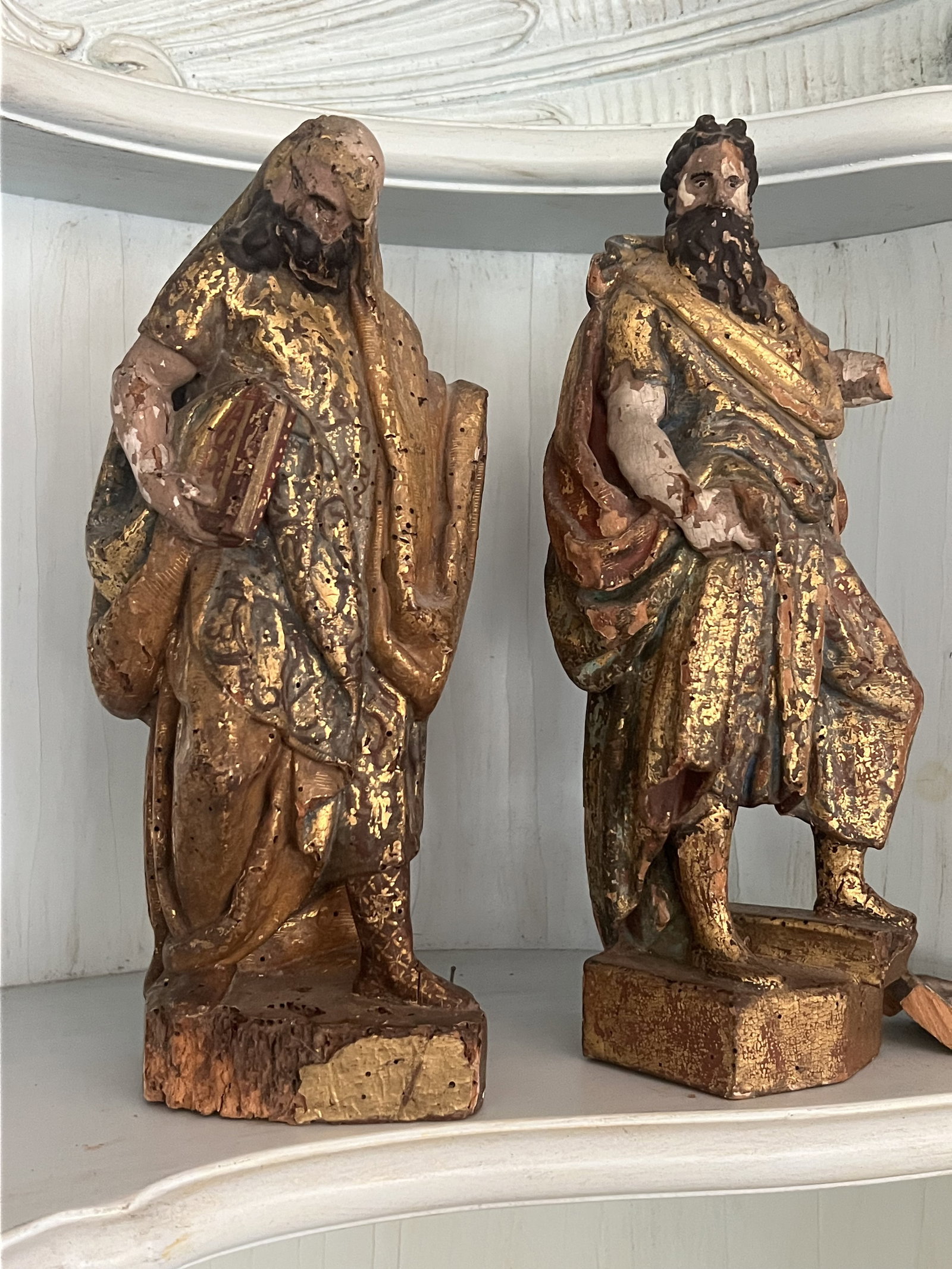(2) Antique 17th-18th Century Polychrome Apostle or Saints: Antique carved wood apostles or saints. Very old, likely Spanish or Viennese. Dimensions: H 12" x W 5" x D 4" Condition: As shown with age, wormholes and some dry rot to bottom of one. One with break