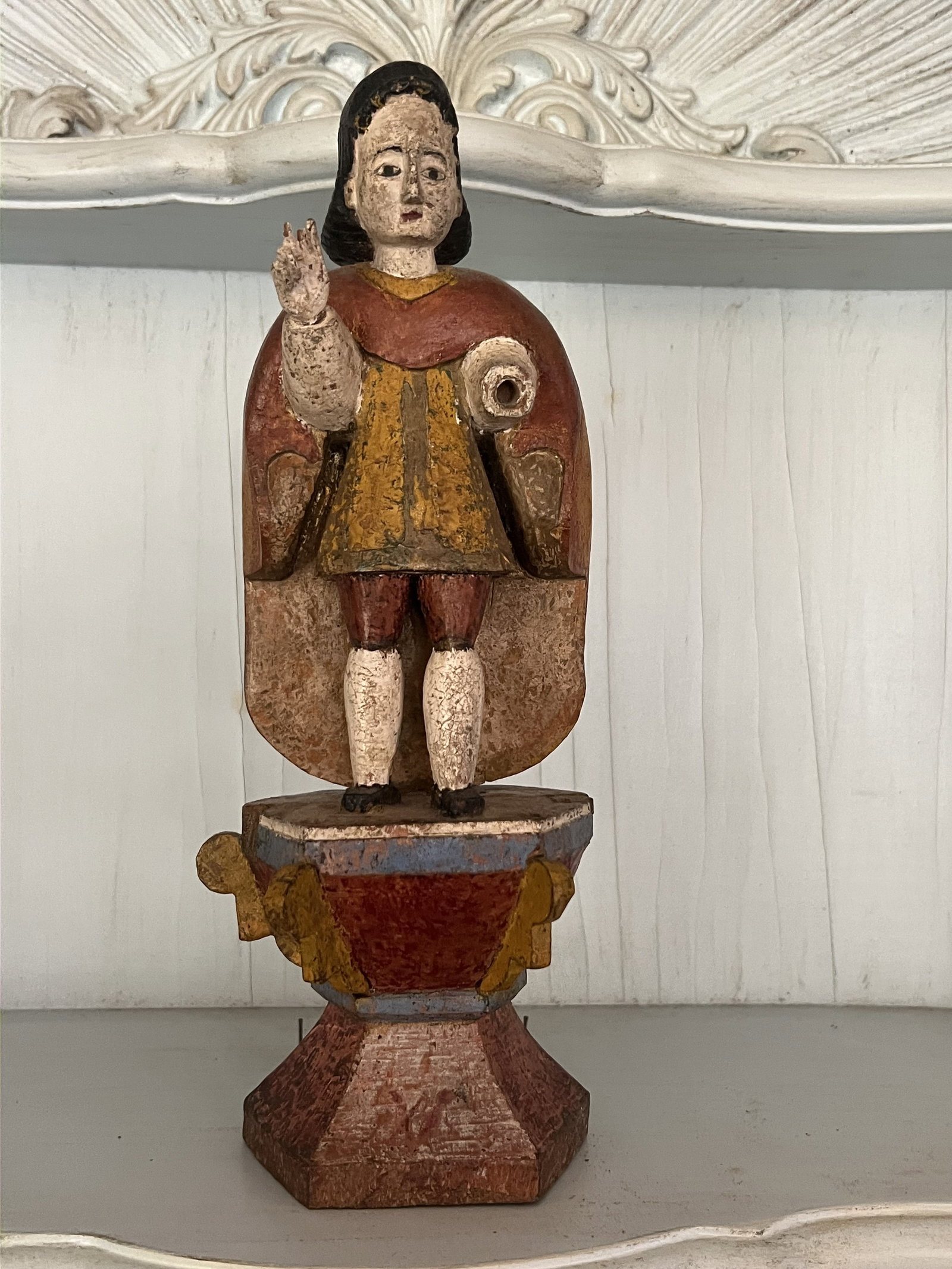 Antique Carved Wood Religious Figure: Spanish style santo or saint, carved and painted wood. Dimensions: H 11.5" x W 5" Condition: Missing hand. Low Estimate: 10.00 High Estimate: 10000.00