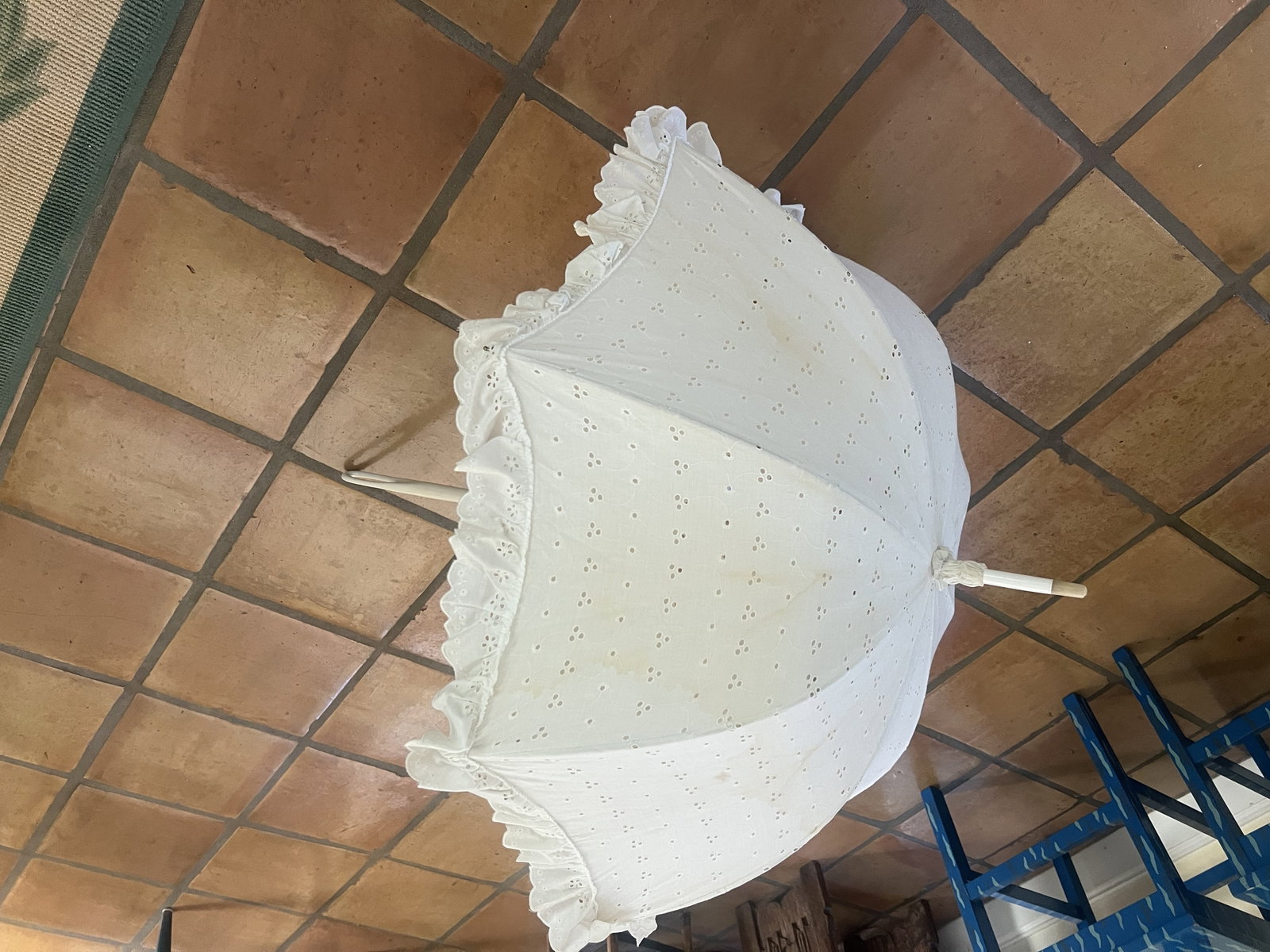 G Gaspar Paris Parasol: 100% cotton, eyelet, Dimensions: L 38.5" Condition: Water stain, no rips or tears, opens and closes nicely. Low Estimate: 10.00 High Estimate: 10000.00