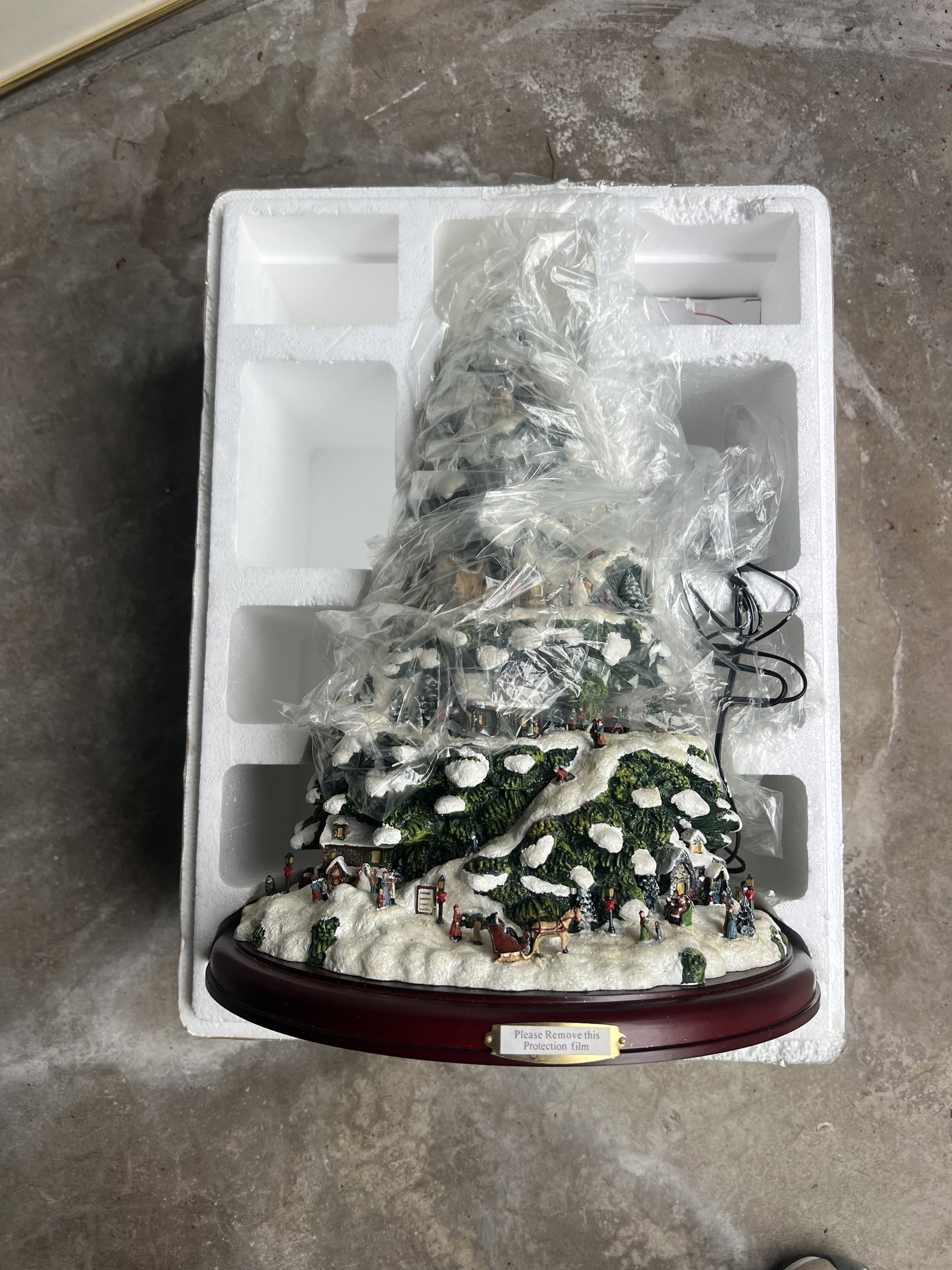 Thomas Kincade Vintage Village Christmas Tree: Illuminated Tree, rotates and plays music. Large: Dimensions: H 15.5" Low Estimate: 10.00 High Estimate: 10000.00