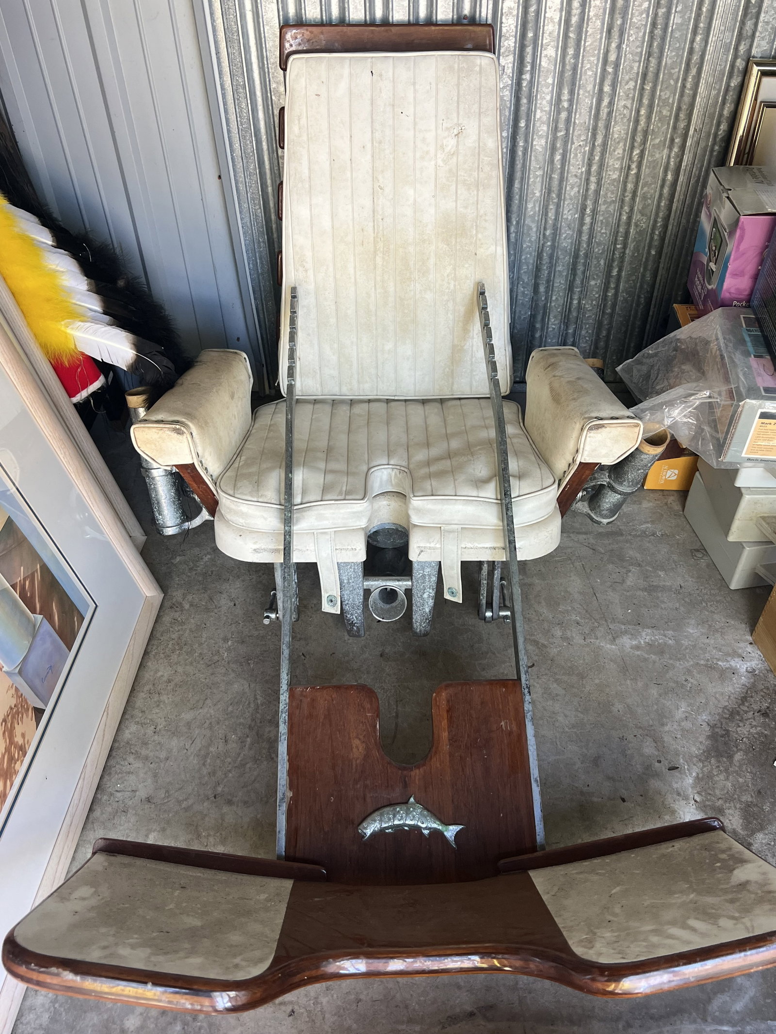 Fish Fighting Chair: Professional fishing chair, teak, marine grade faux leather, stainless steel. Really quality fish fighting chair in sound condition. Minor wear to cushions and light wear to wood and metal.