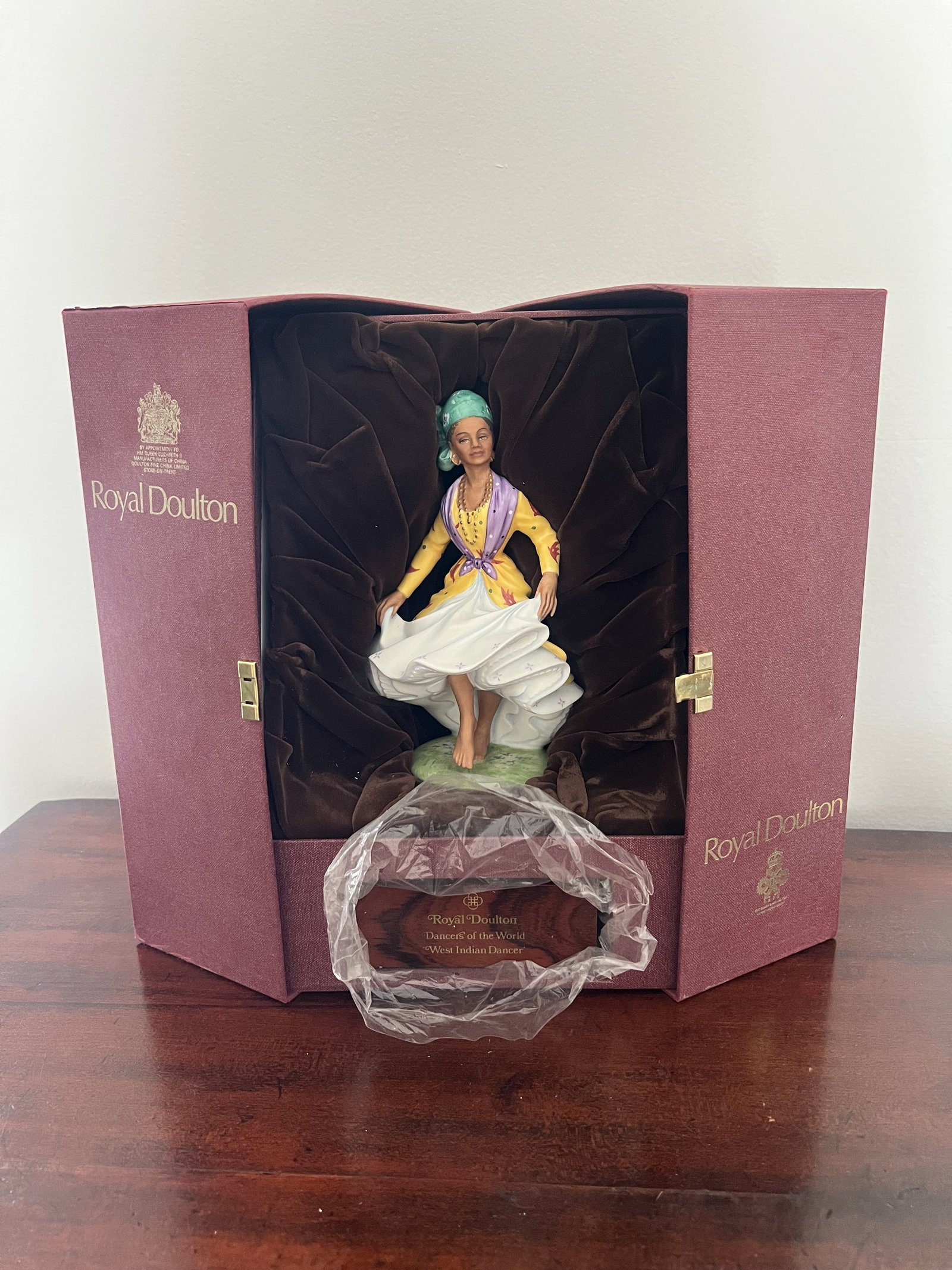 Royal Doulton Dancers of the World West Indian Dancer Figurine: In original presentation box, Dimensions: H 13" x W 9" x D 8" Condition: Presenting well. Low Estimate: 10.00 High Estimate: 10000.00