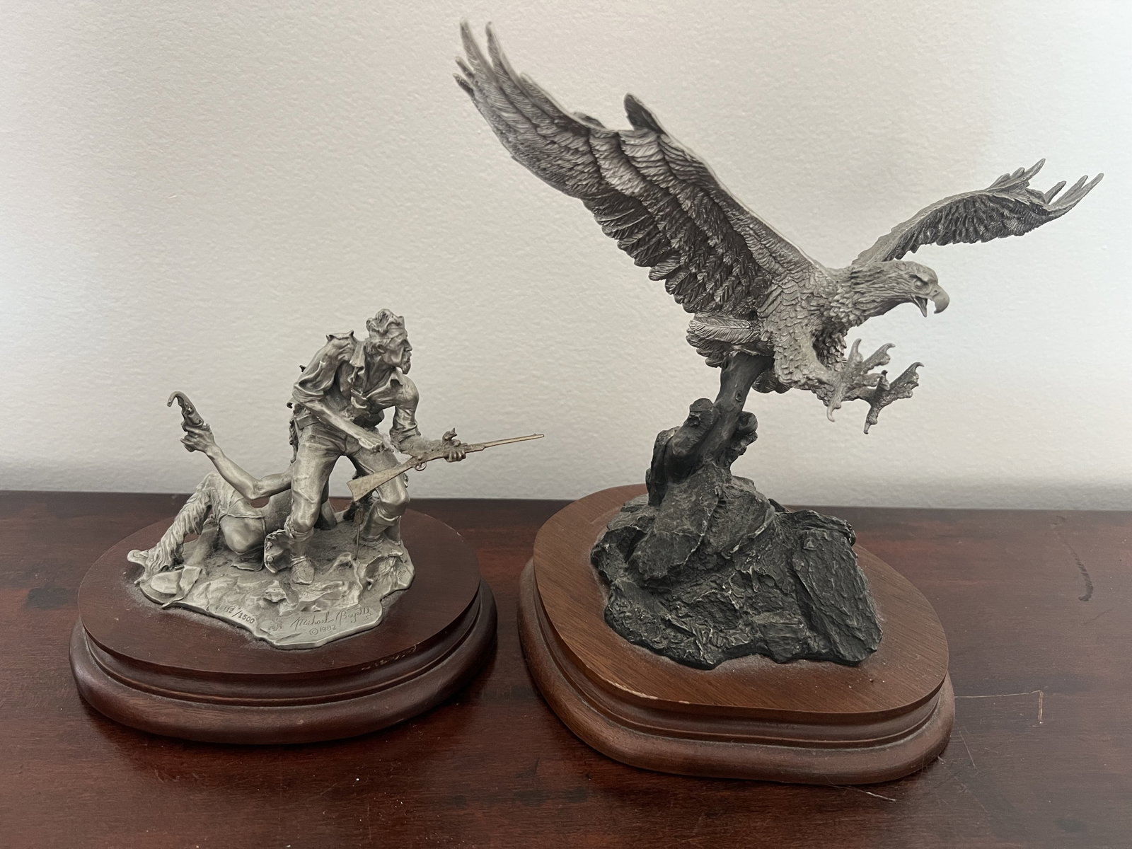 (2) Pewter Americana Sculptures: Chilmark pewter of bald eagle "Triumphant Eagle" and "Blood Brothers". Dimensions: H 9" x W 10" Condition: Presenting well, only minor signs of age. Low Estimate: 10.00 High Estimate: 10000.00