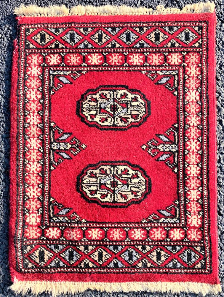 BUKHARA HAND KNOTTED RUG, 18 IN x 24 IN: Bukhara Tekke rug was hand knotted in Pakistan of 100% natural wool. It has full wool piles and is in excellent condition. Beautiful colors with excellent quality. No holes or repairs, and very soft. 