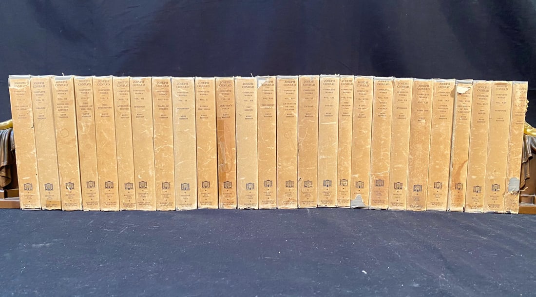 JOSEPH CONRAD’S BOOK SET, KENT EDITION - 26 VOLUMES – 1926: 1926. New York. Doubleday, Page and Company. 26 volumes. All volumes are in Near Fine to Very Good condition. All volumes have gray cloth hard covers and tan dust jackets. Black lettering for the titl