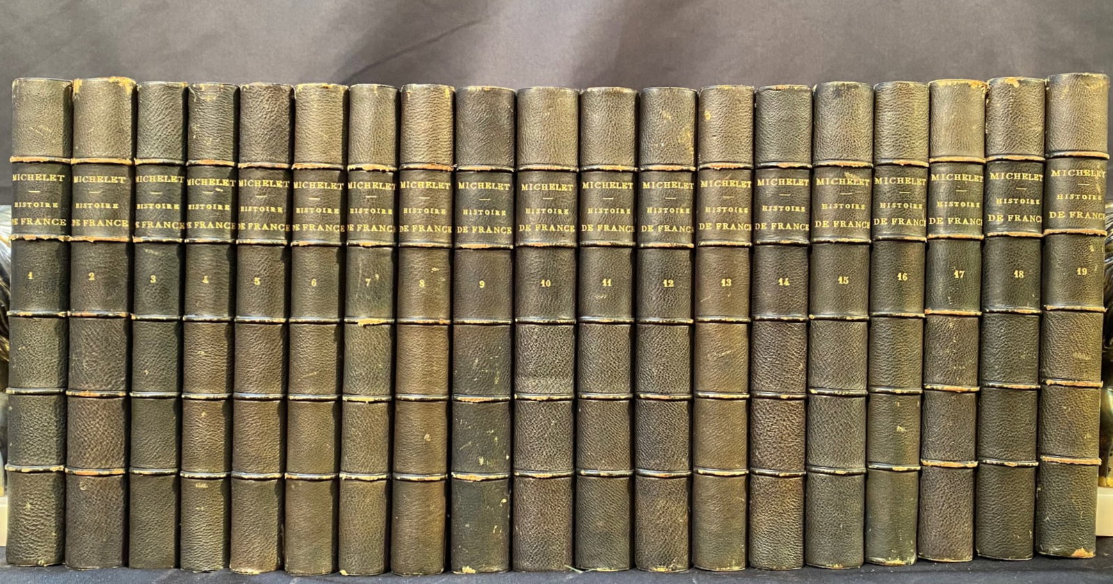 HISTOIRE DE LA RÉVOLUTION FRANCAISE PAR JULES MICHELET, 19 VOLUMES, 1876-1877: 1876-1877. Paris, France. Complete in 19 volumes. Published by Imprimerie Moderne. All volumes are in Very Good condition, bound in half black leather with blue marbled boards. Written entirely in Fre