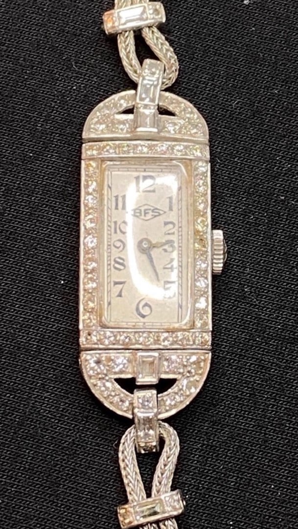 14K GOLD AND DIAMOND ART DECO BFS LADIES WATCH WITH RECENT APPRAISAL: 14K white gold and diamond Art Deco BFS Ladies watch. It features 62 total diamonds, broken into 2 sets. The first set has 56, genuine, round, full cut diamonds. The diamonds range in weight from .009