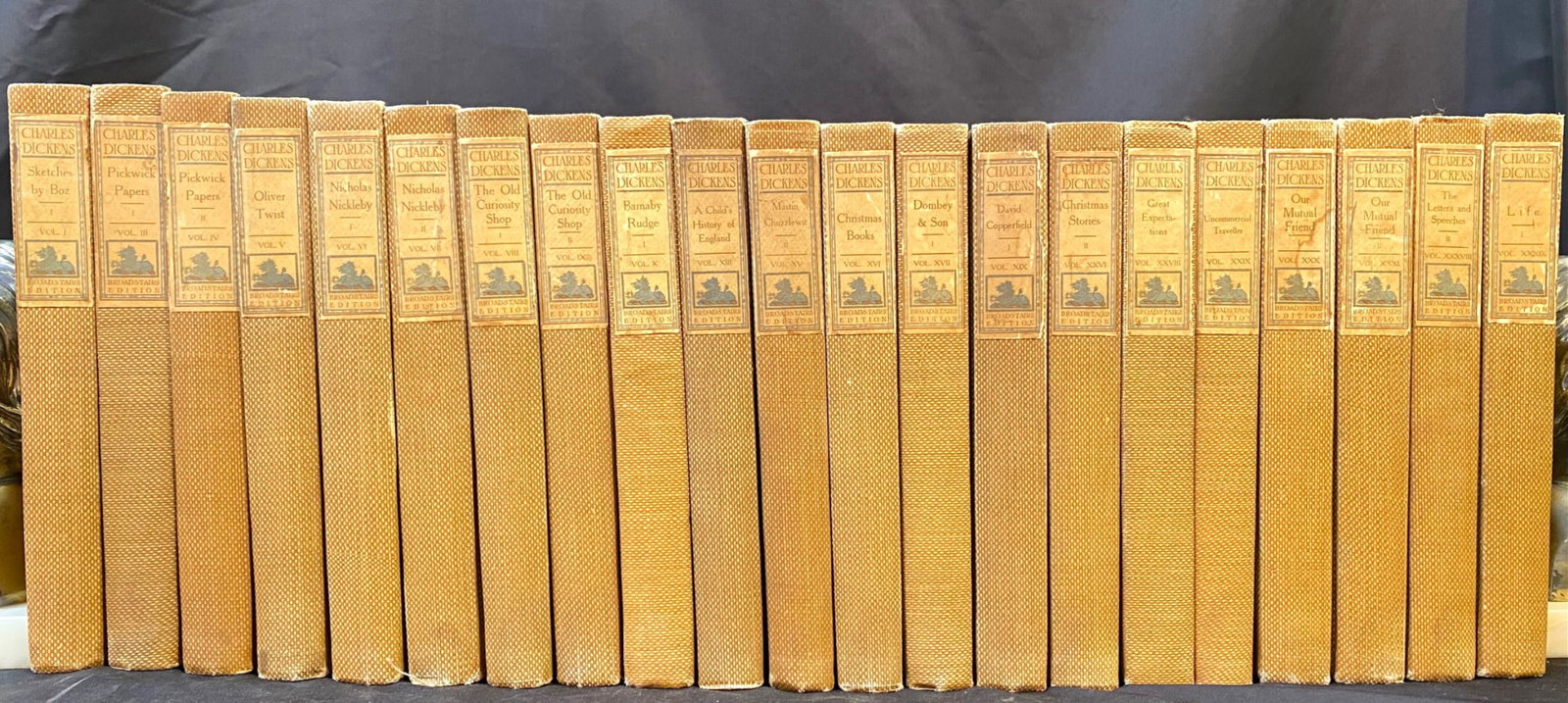WORKS OF CHARLES DICKENS, BROADSTAIRS EDITION, CIRCA 1900s, 21 VOLUMES: London. Circa 1900s. Macdonald and Sons, Publisher. 21 Volumes. All volumes in Very Good+ to Very Good condition. This is the Broadstairs limited edition set, it being 80 of 250. Bound in tan cloth, w