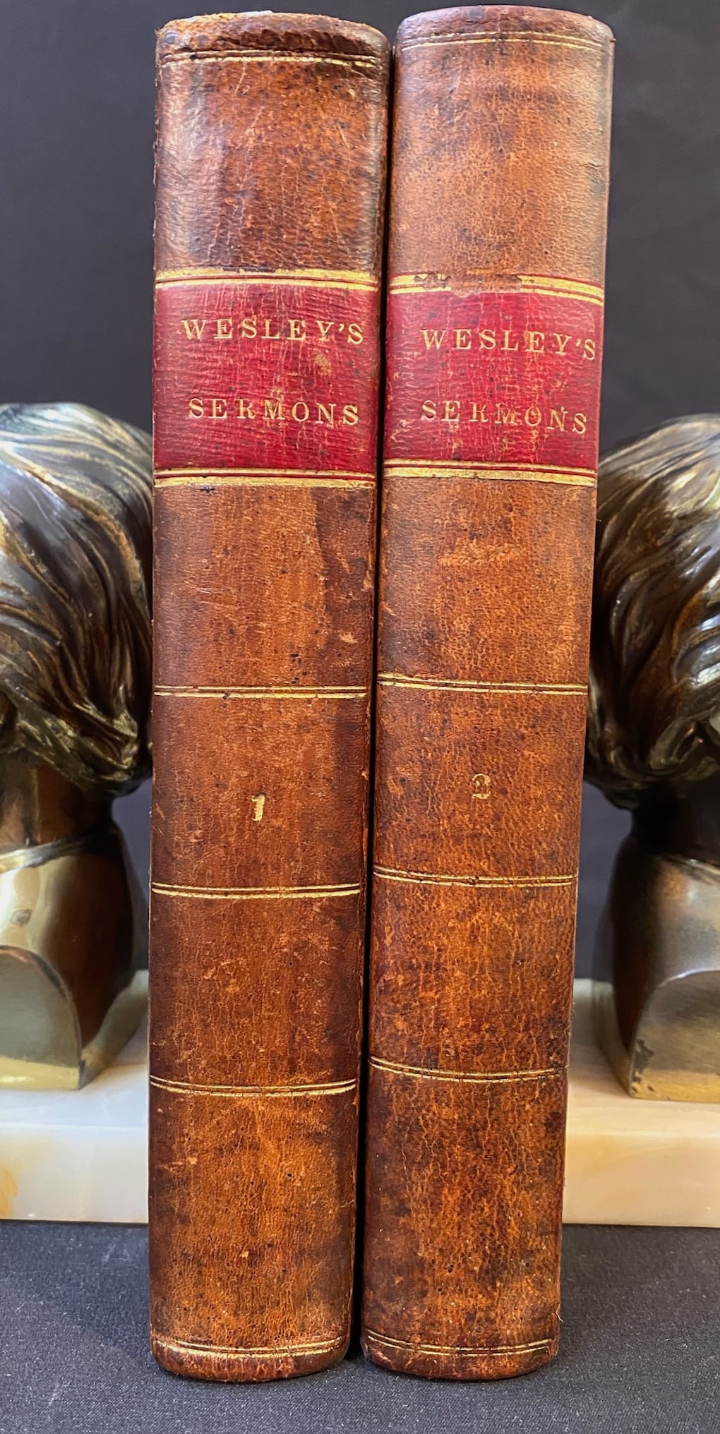 SERMONS ON SEVERAL OCCASIONS BY THE REV. JOHN WESLEY, 2 VOLUMES, 1834: 1834. New York. B. Waugh and T. Mason, Publisher. Complete in 2 volumes and both Volumes are in Very Good condition. Both volumes are bound in full, brown leather, with red and gold embossing on the s