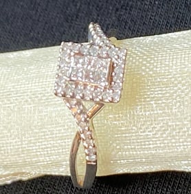 STERLING SILVER AND DIAMOND ENGAGEMENT RING