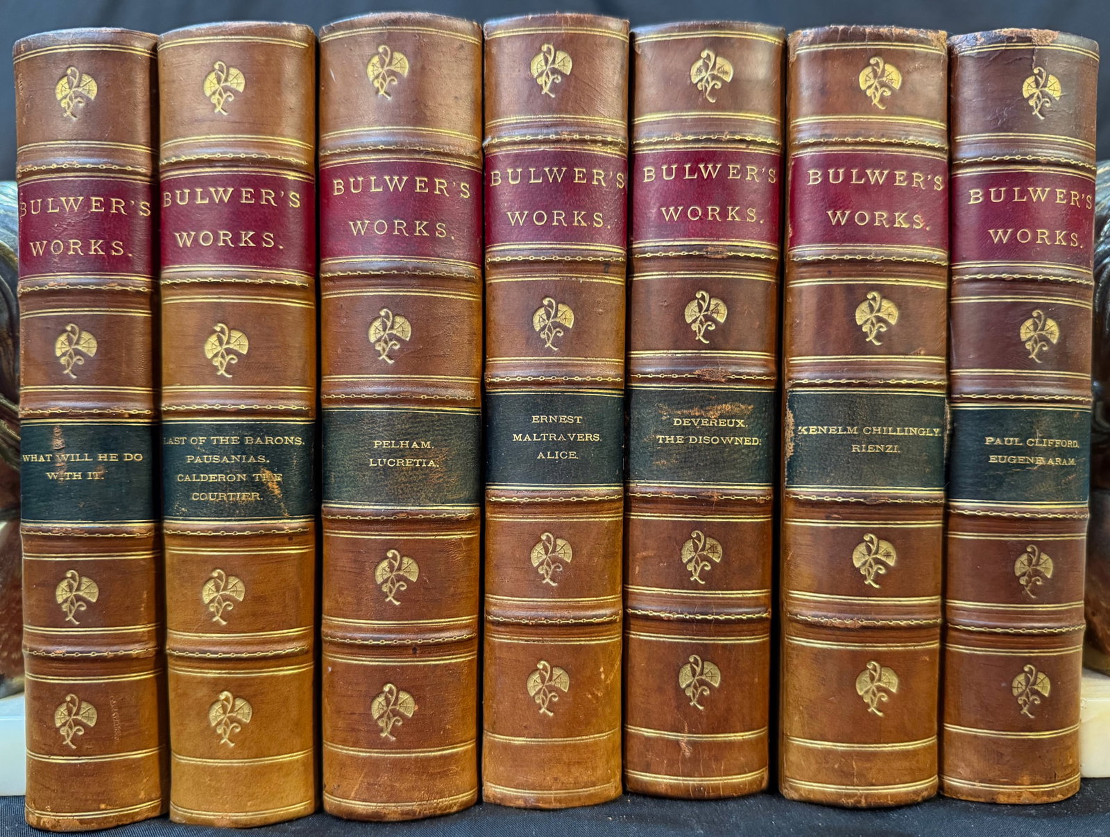 BULWER’S WORKS, 7 VOLUMES, 1858: Chicago and New York. 1858. Bedford, Clarke and Company, Publishers. 15 Stories in 7 volumes. All volumes in Very Good condition, and bound in half tan leather hardcovers with marbled boards, and embo