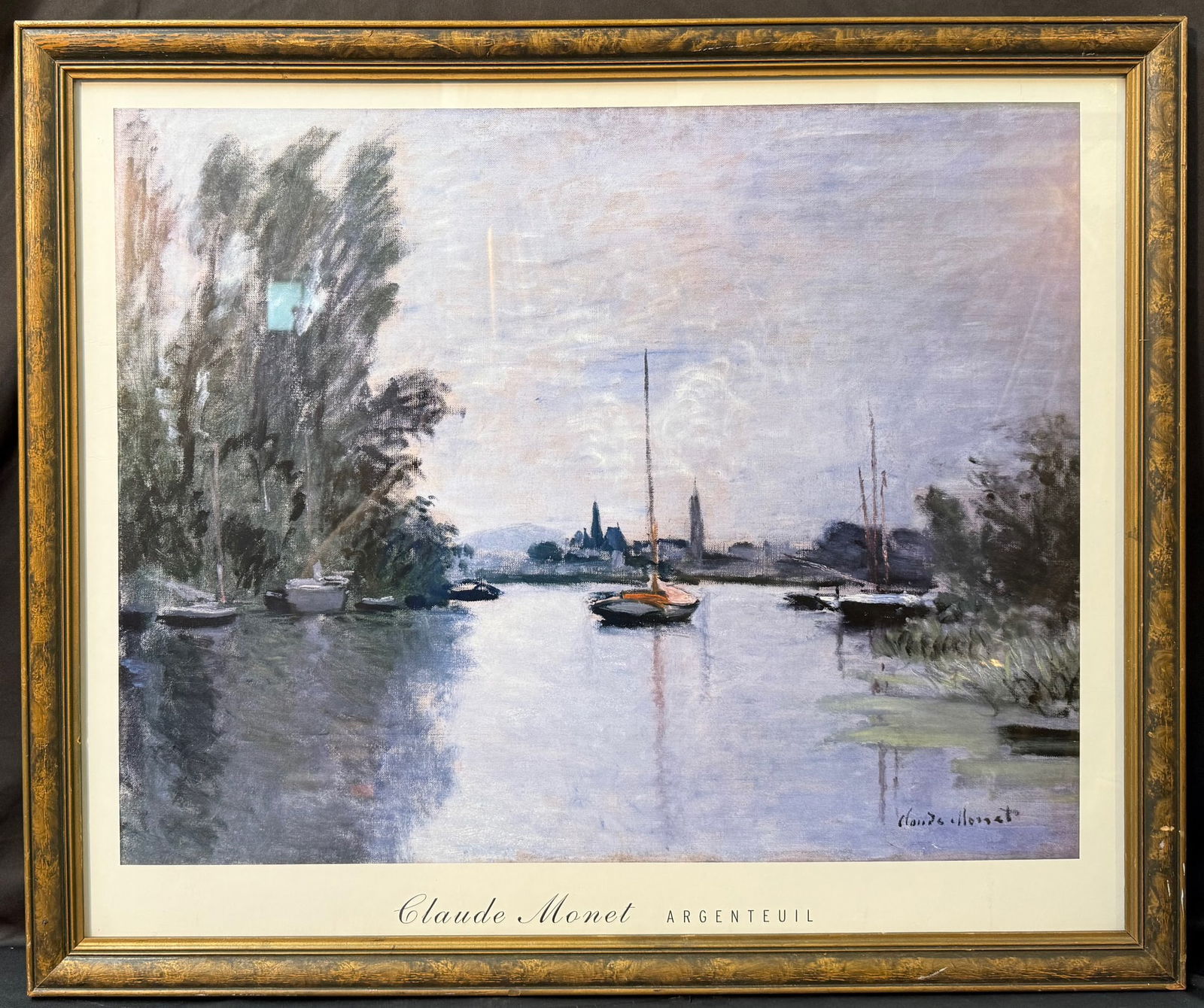 CLAUDE MONET (1840-1926) LITHOGRAPH TITLED ARGENTEUIL SEEN FROM THE SMALL ARM OF THE SEINE, 28IN x: Claude Monet (1840-1926) lithograph titled Argenteuil Seen from the Small Arm of the Seine. This lithograph is after the original which was painted in 1872. It is mounted and framed in a golden