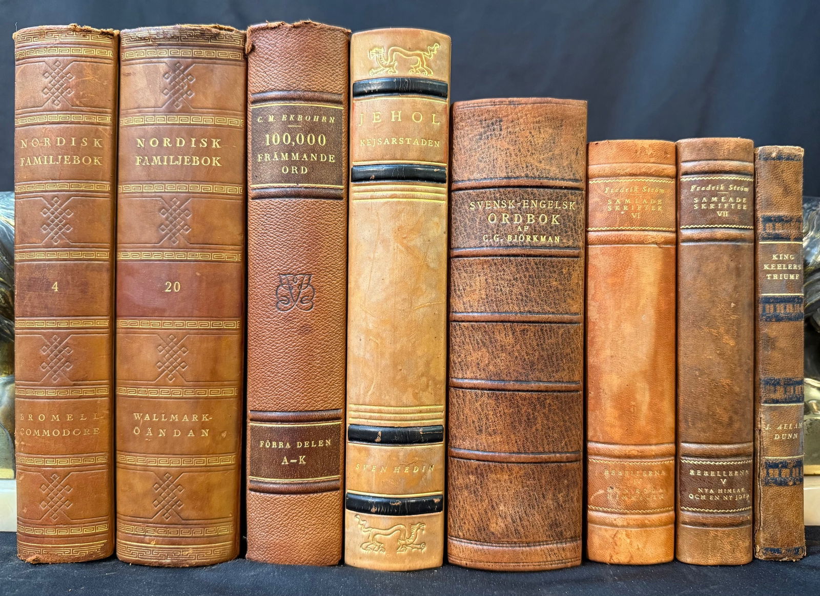 SWEDISH LEATHER-BOUND BOOK SET, 8 VOLUMES: 1900s. Stockholm. Various Publishers, Publisher. 8 leatherbound books written in Swedish. All volumes are in Very Good+ to Very Good condition. Written entirely in Swedish. All volumes are bound in fu