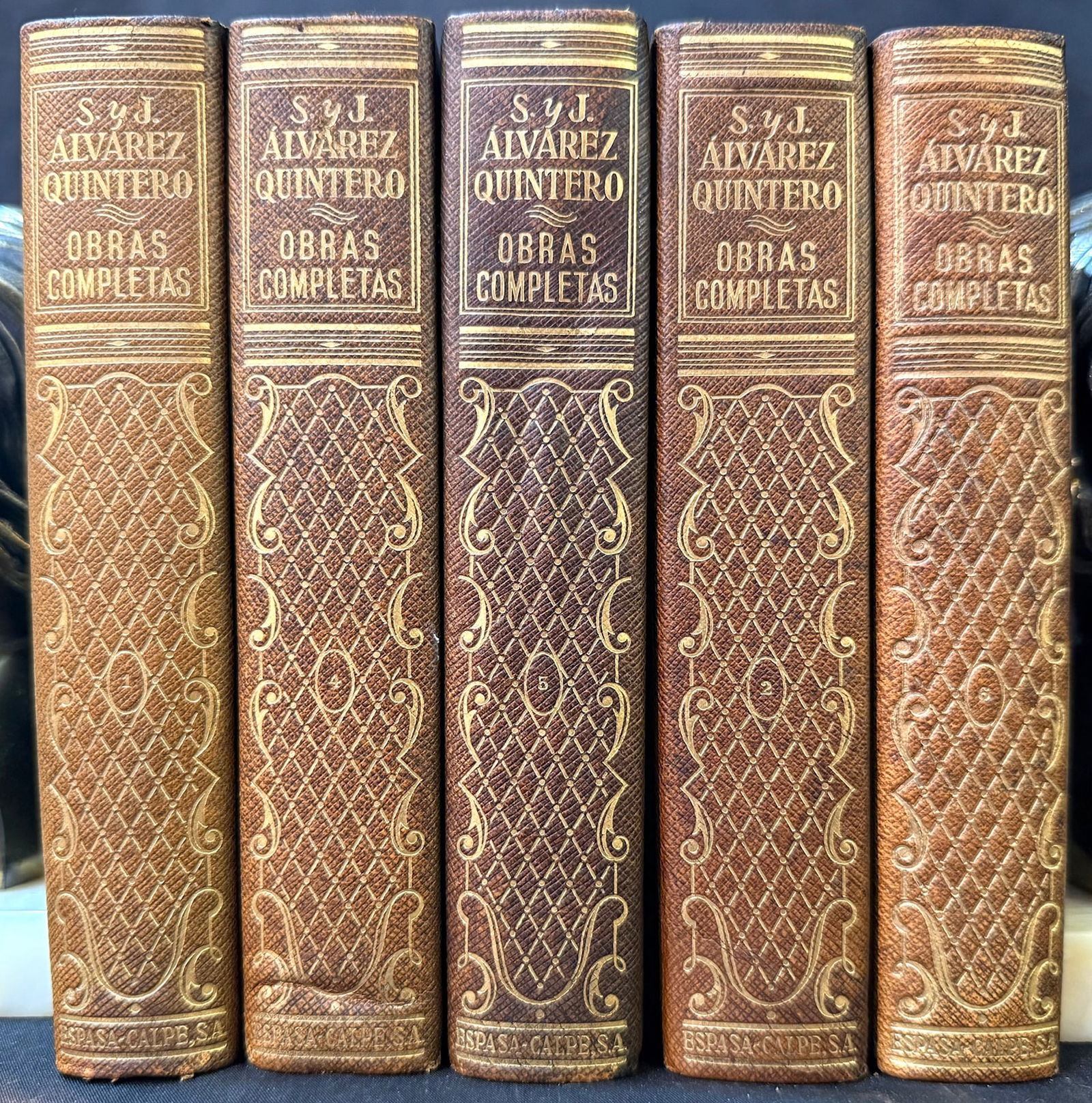 OBRAS COMPLETAS DE S. Y J. ALVAREZ QUINTERO, 5 VOLUMES, 1967: Madrid. 1967. Espasa-Calpe, S.A., Publishers. 5 Volumes of a set of 42, all in Near Fine to Very Good+ condition. All volumes bound in brown, full leather, with gold embossing on the spine and cover f