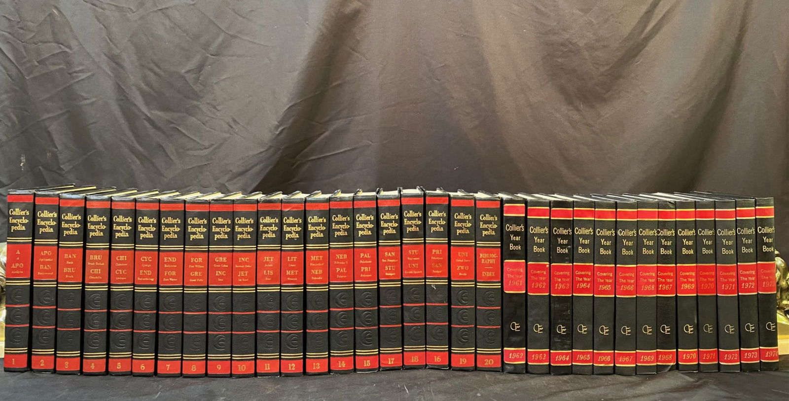 COLLIERS ENCYCLOPEDIA SET, 20 VOLUMES AND 13 YEARBOOKS, 1961: 1961. New York. The Crowell-Collier Publishing Company. Complete 20 volume set and 13 yearbooks. All volumes are in Very Good++ condition. All volumes are black faux leather hardback, with red and gol
