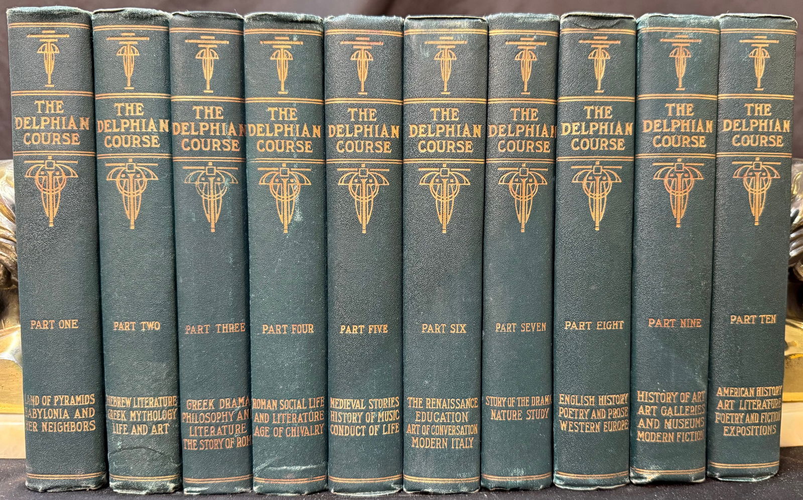 THE DELPHIAN COURSE, 10 VOLUMES, 1928: 1928. Hammond, IN. W.B. Conkey Company, Publisher. Complete in 10 volumes. All volumes are in Very Good+ to Very Good condition. All volumes are bound in green cloth hard cover and embossed in gold on