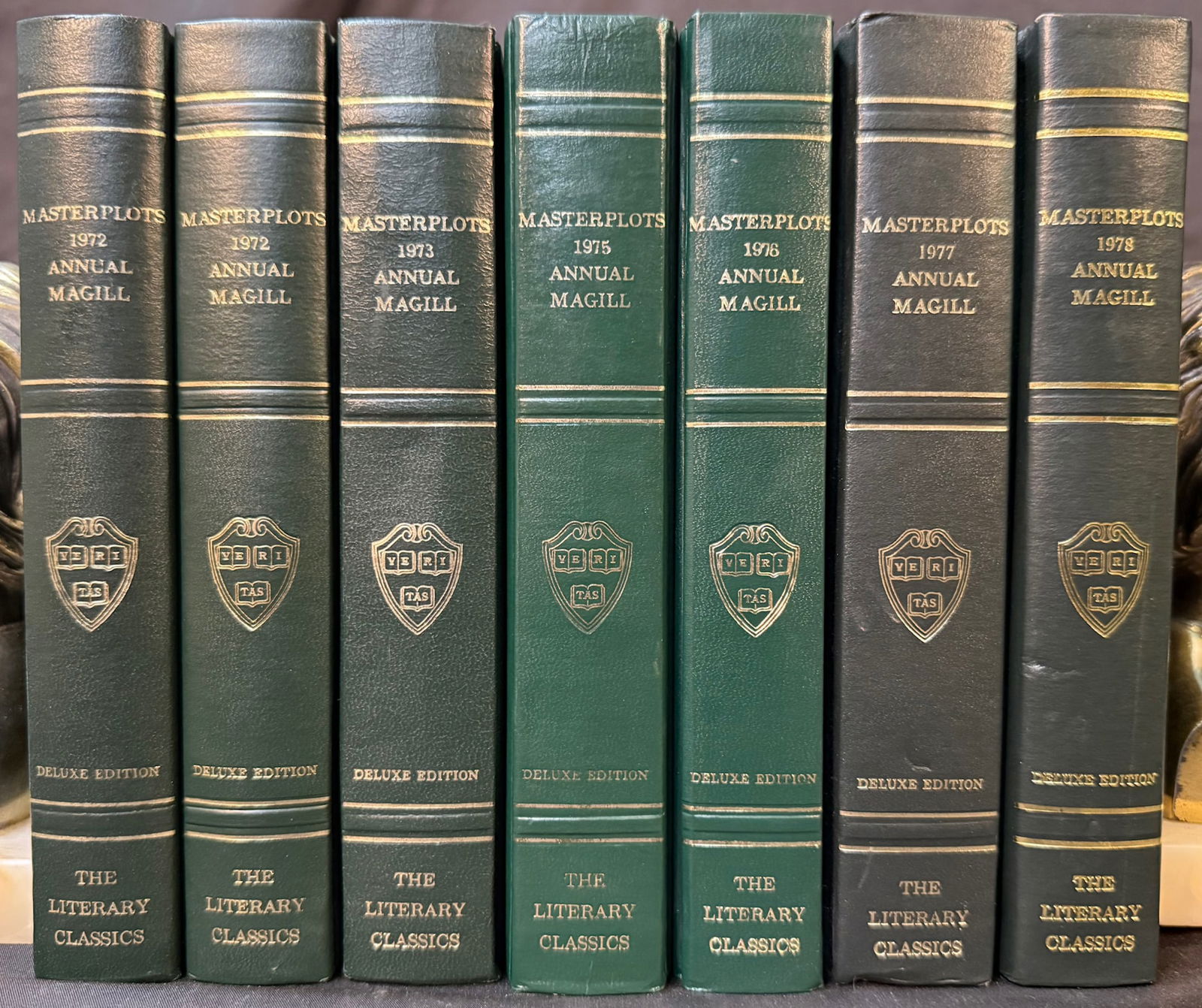 MASTERPLOTS ANNUAL BY FRANK MAGILL, 7 VOLUMES, 1972-1978: 1972-1978. Englewood Cliffs, NJ. Salem Press, Publisher. 7 volumes. All volumes are in Very Good+ condition. All volumes are bound in full, dark green leatherette with no dust jackets. All volumes emb