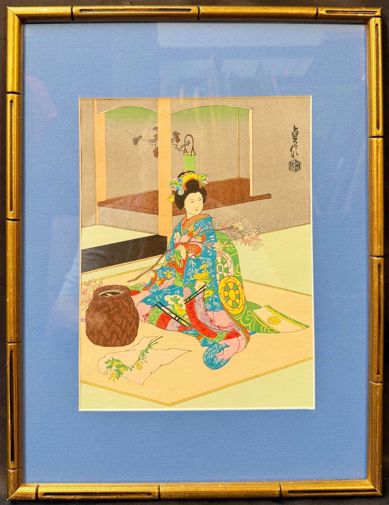ORIGINAL JAPANESE WOODBLOCK PRINT BY SADANOBU HASEGAWA III (1881-1963) TITLED MAIKO GIRL, DOING: An original Japanese woodblock print by Sadanobu Hasegawa III (1881-1963) titled Maiko Girl, Doing Flower Arrangement. This piece is believed to have been printed in the 1950s, and it is matted and fr