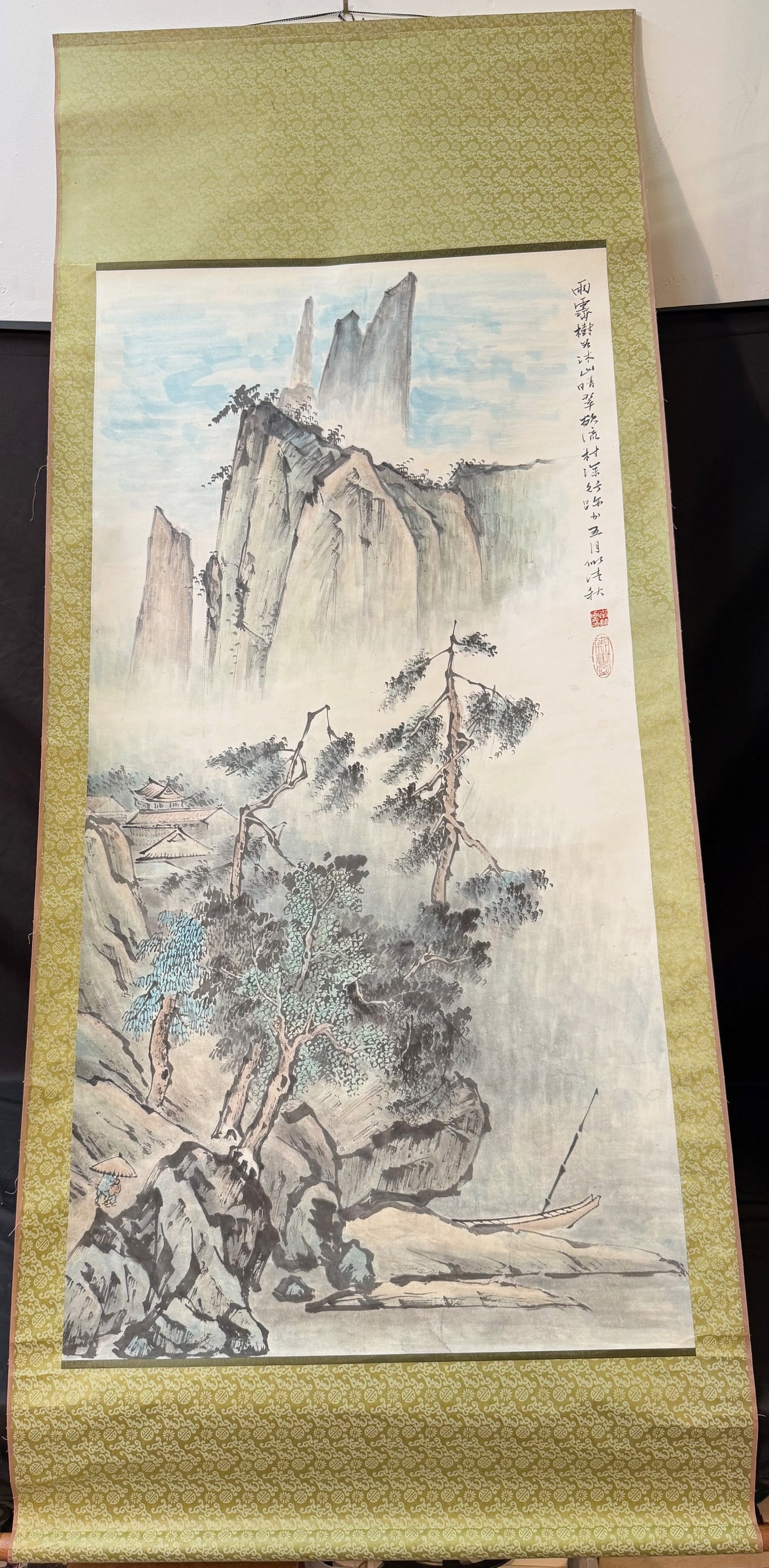 QI BAISHI (1864-1957) CHINESE SCROLL OF MOUNTAINOUS LANDSCAPE, 32IN x 76IN (81cm x 193cm): A Qi Baishi (1864-1957) Chinese scroll of a mountainous landscape with several persons in a pavilion. With title, seal and chop in the upper left corner. The entire scroll measures 32 inches X 76 inch