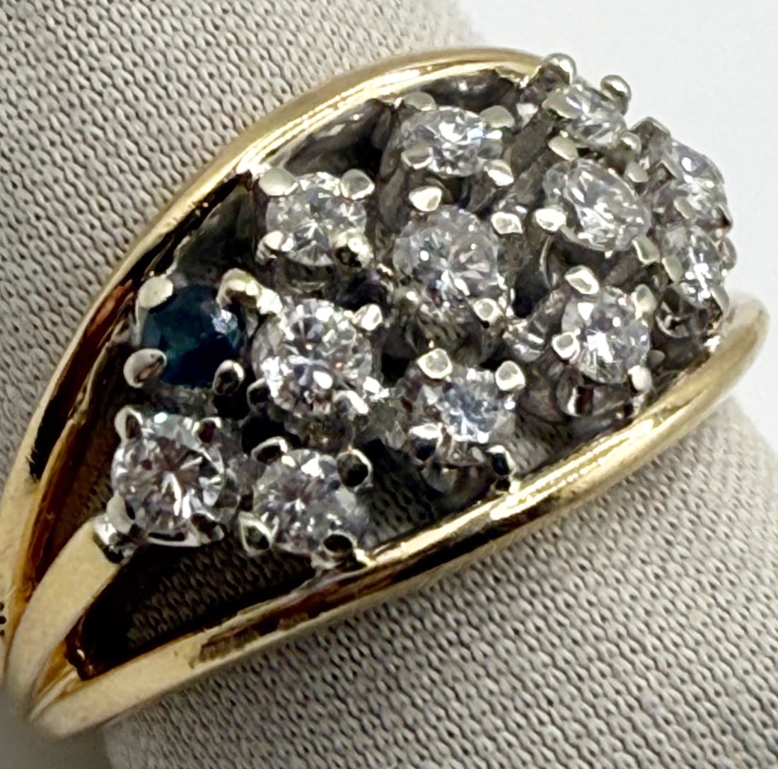 14K DIAMOND AND ONE SAPPHIRE CLUSTER RING WITH RECENT APPRAISAL: One 14k yellow gold diamond and one sapphire cluster ring. Mounted in this ring are three rows of stones. The top and bottom row contain four stones each with one row all round brilliant cut diamonds