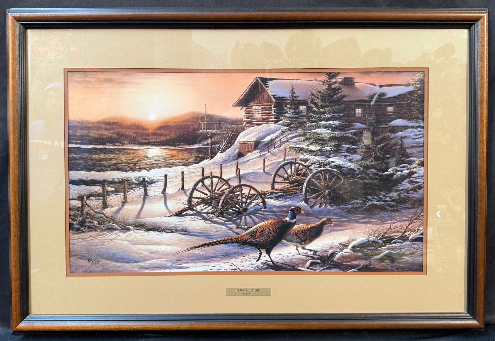 TERRY REDLIN (1936) ORIGINAL LITHOGRAPH WITH COA TITLED PEACEFUL EVENING, 22IN x 32IN (56cm x 81cm): An original lithograph by South Dakota artist Terry Redlin (1936). This piece was created by the artist in 2001. This piece is double matted and framed under glass in a wooden frame and it comes with