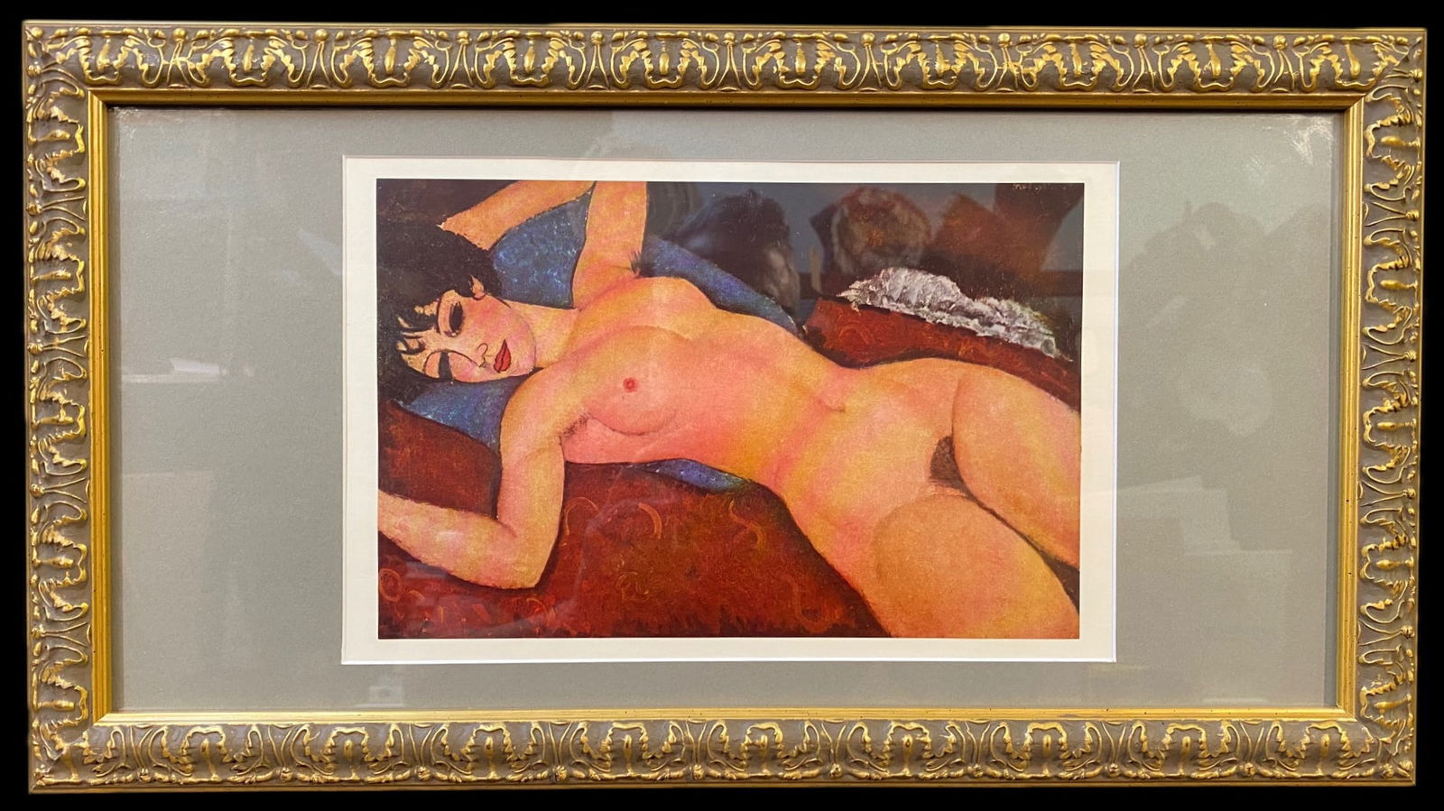 AMEDEO MODIGLIANI (1884-1920) LITHOGRAPH TITLED NUDE ON A CUSHION, 12IN x 24IN (30cm x 61cm): Amedeo Modigliani (1884-1920) lithograph titled Nude on a Cushion, after the original that was painted in 1917. The piece with frame measures 12 inches x 24 inches. This piece was acquired from a Metr