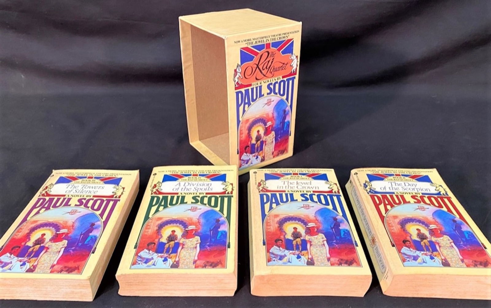 RAJ QUARTET BY PAUL SCOTT – FIRST EDITION, 4 VOLUME BOX SET – 1979: 1979. New York, NY. Avon Books. 4 volume box set. All volumes and box are in Very Good condition. All volumes are paperback. No owners markings or bookplates. FREE SHIPPING FOR THIS BOOK SET WITHIN TH
